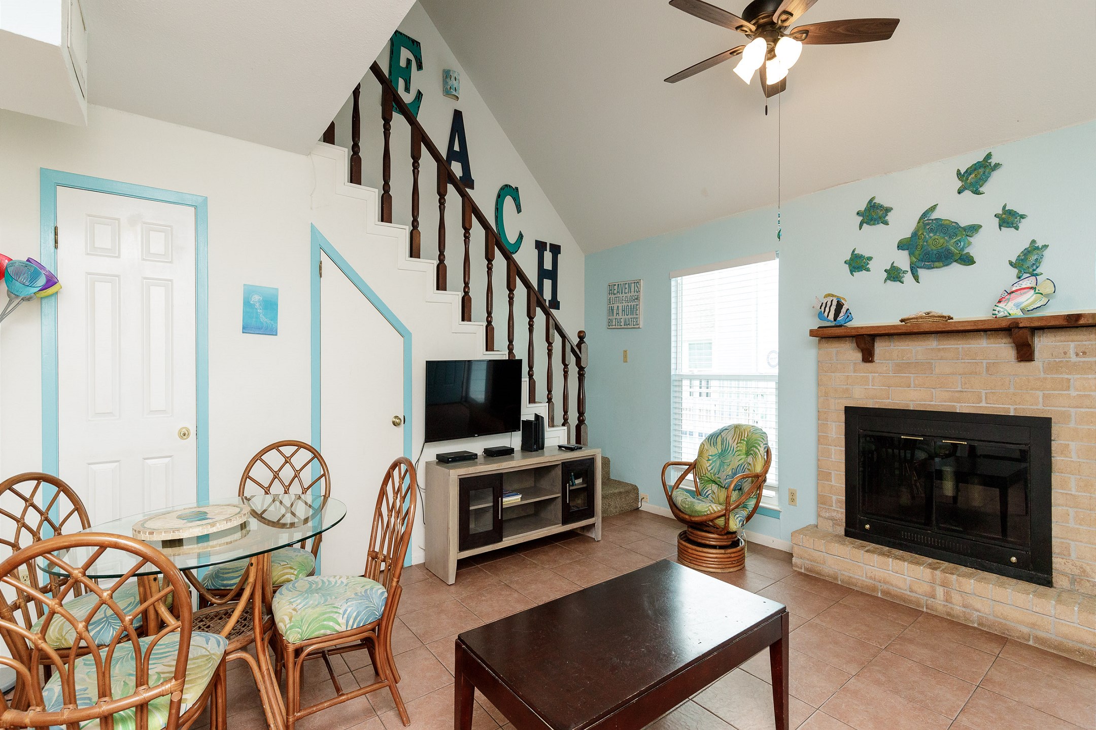 Living area with new TV entertainment stand and unique décor