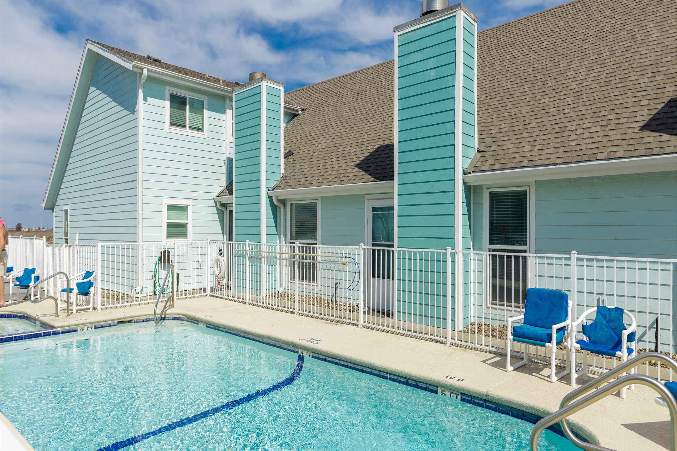 Sparkling pool area to spend time at on your vacation and soak up the sun