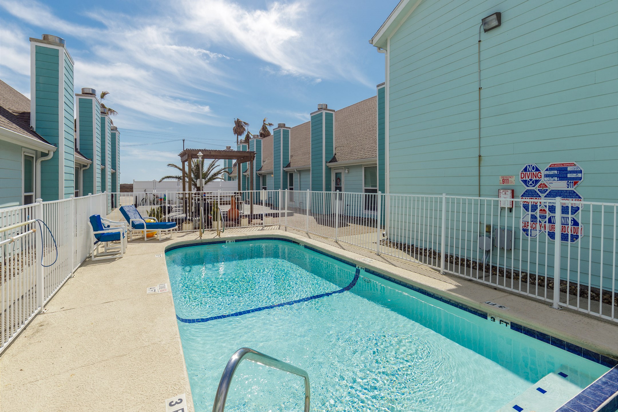 Leeward Cove sparkling pool to relax at with loungers 
