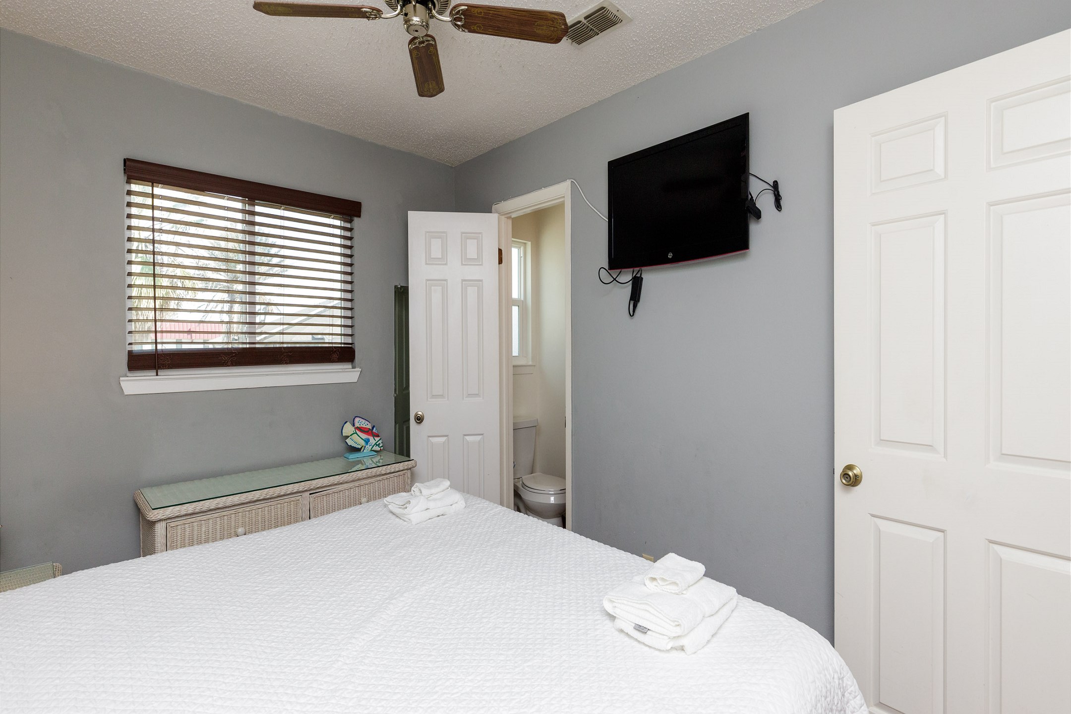 Master bedroom with king size bed and flat screen TV