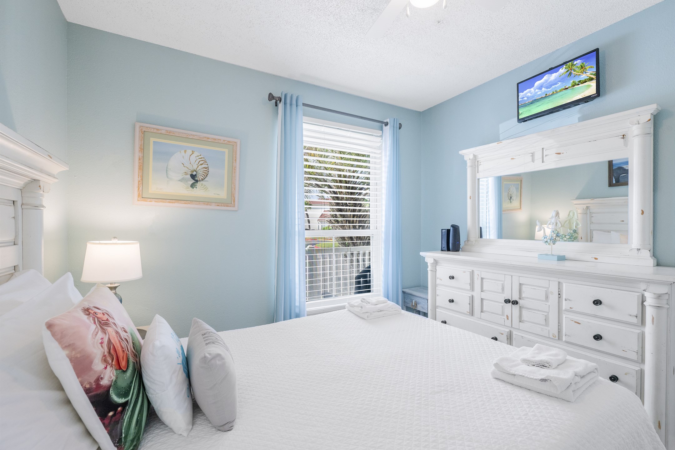 Master bedroom with king size bed, flat screen TV and private bathroom