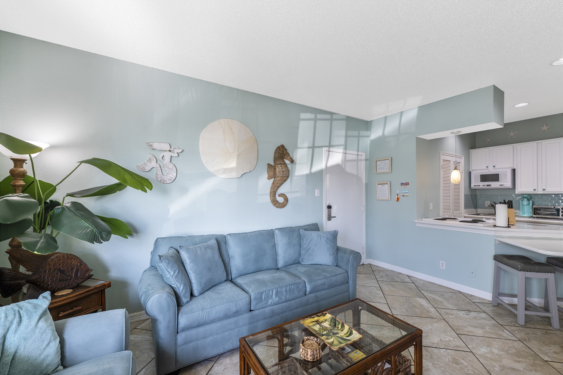 Stylish living room with chic décor and seamless flow into the dining and kitchen spaces