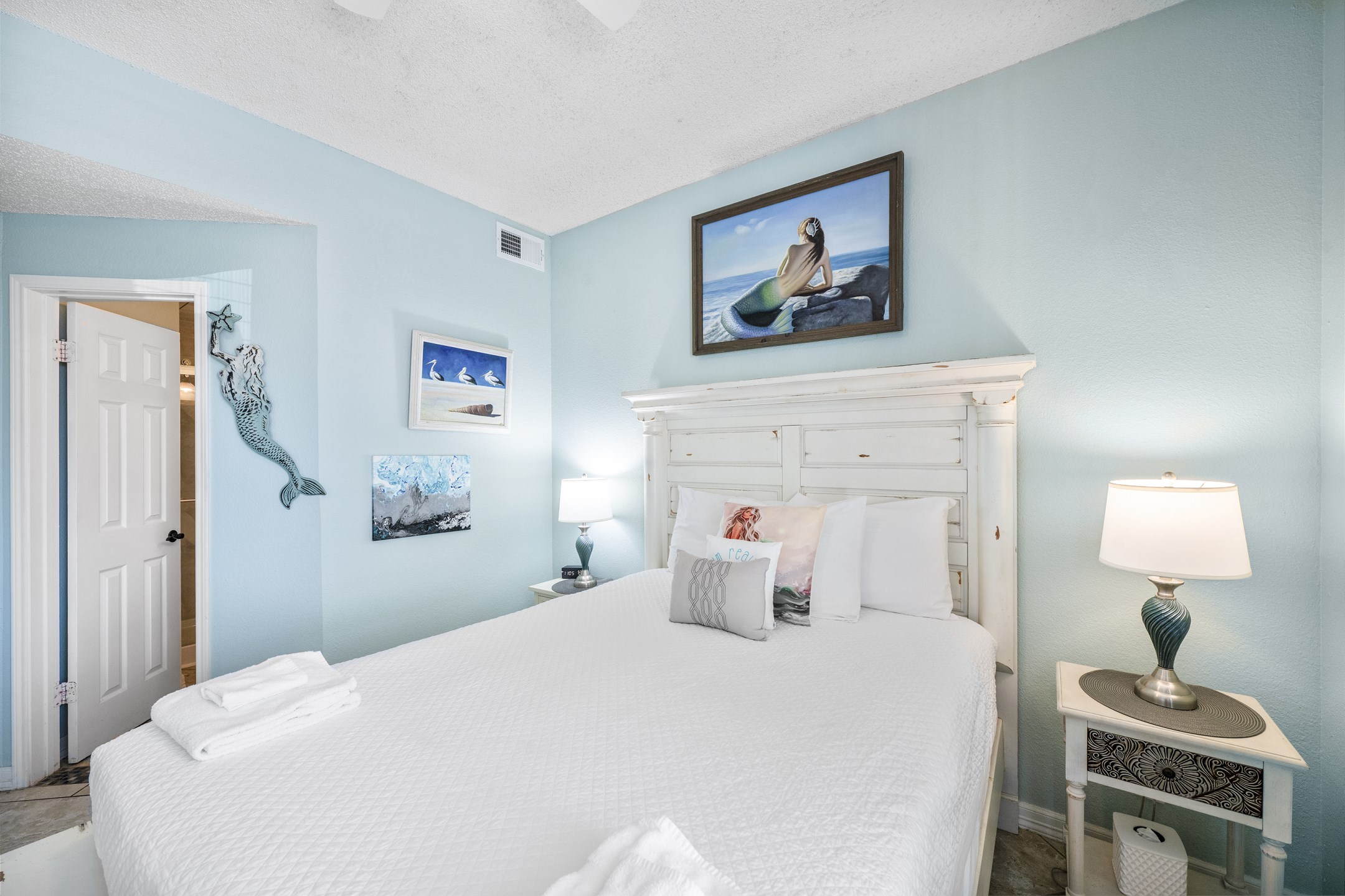 Master bedroom with king size bed, flat screen TV and private bathroom