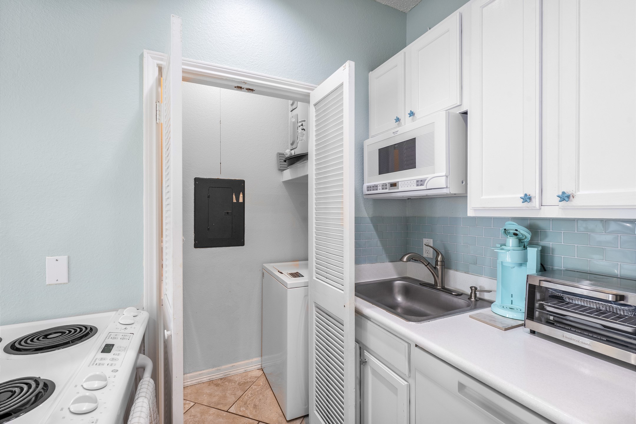 Vacation rental kitchen with coastal charm and everything you need to cook up meals