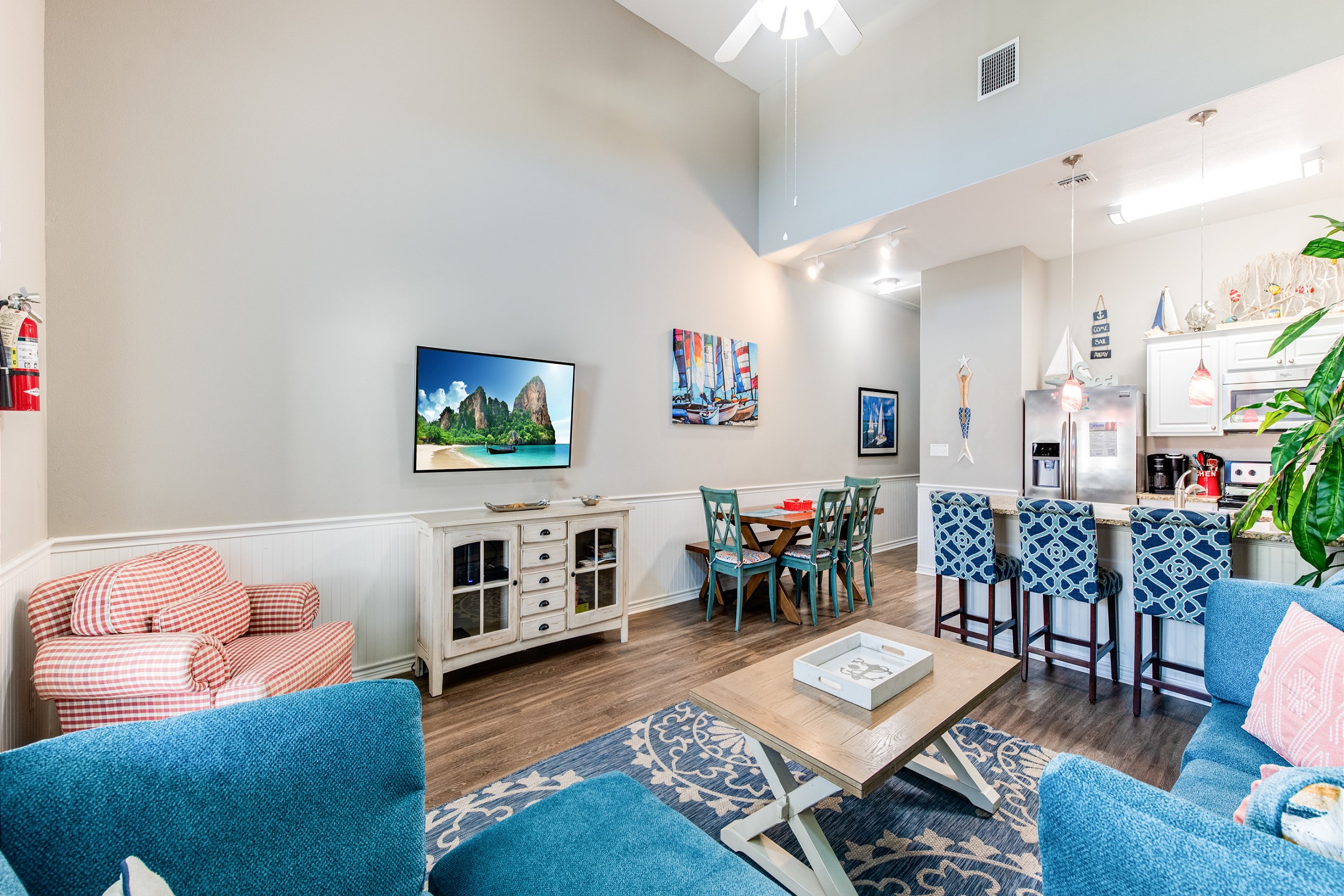 The kitchen, dining, and living areas blend seamlessly for a bright and airy feel