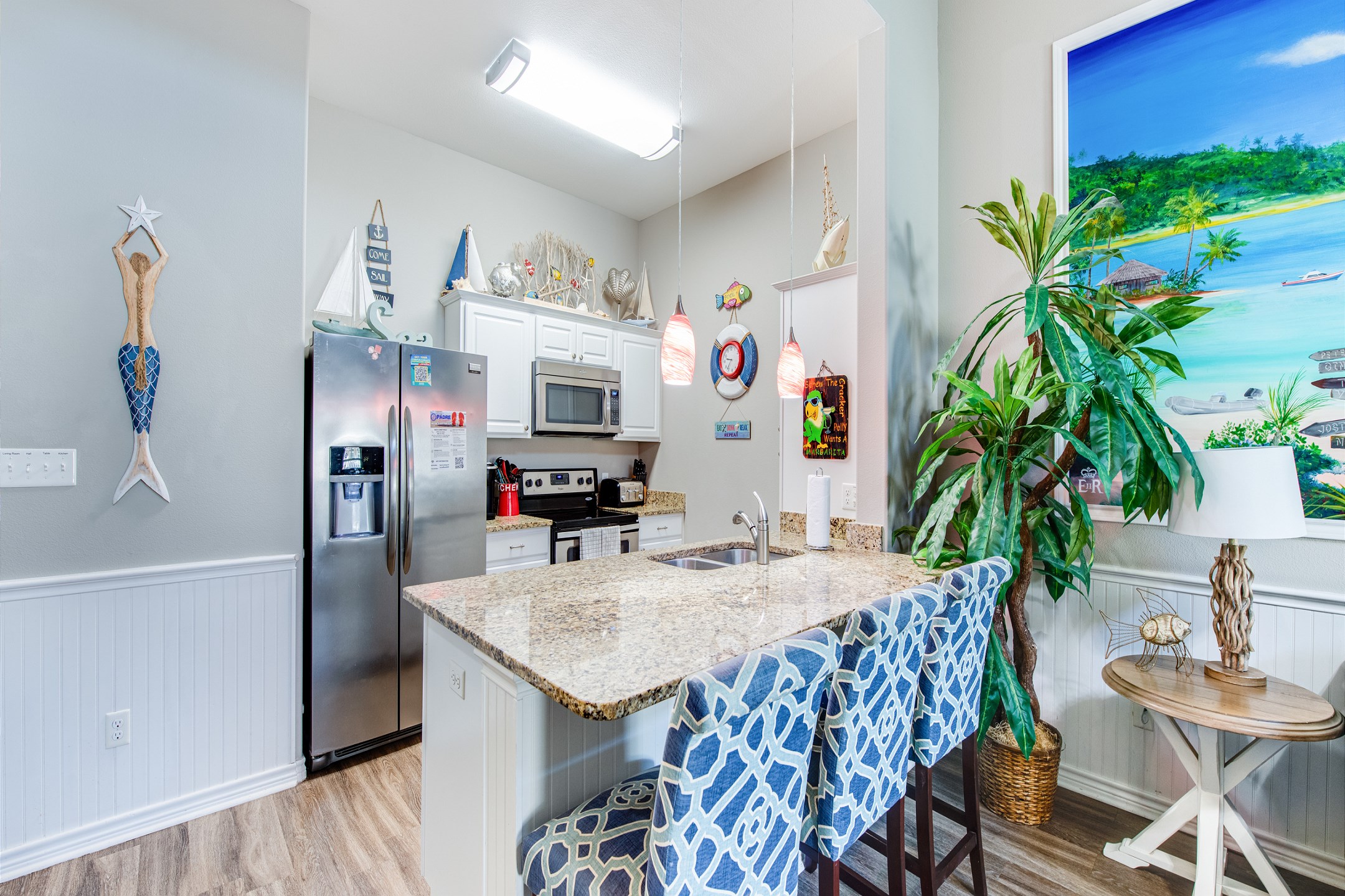 Breakfast bar, seating for three with beautiful counter tops 