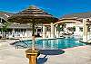 Relax under one of the poolside palapas