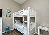 Second bedroom with queen bed and twin size bunk beds