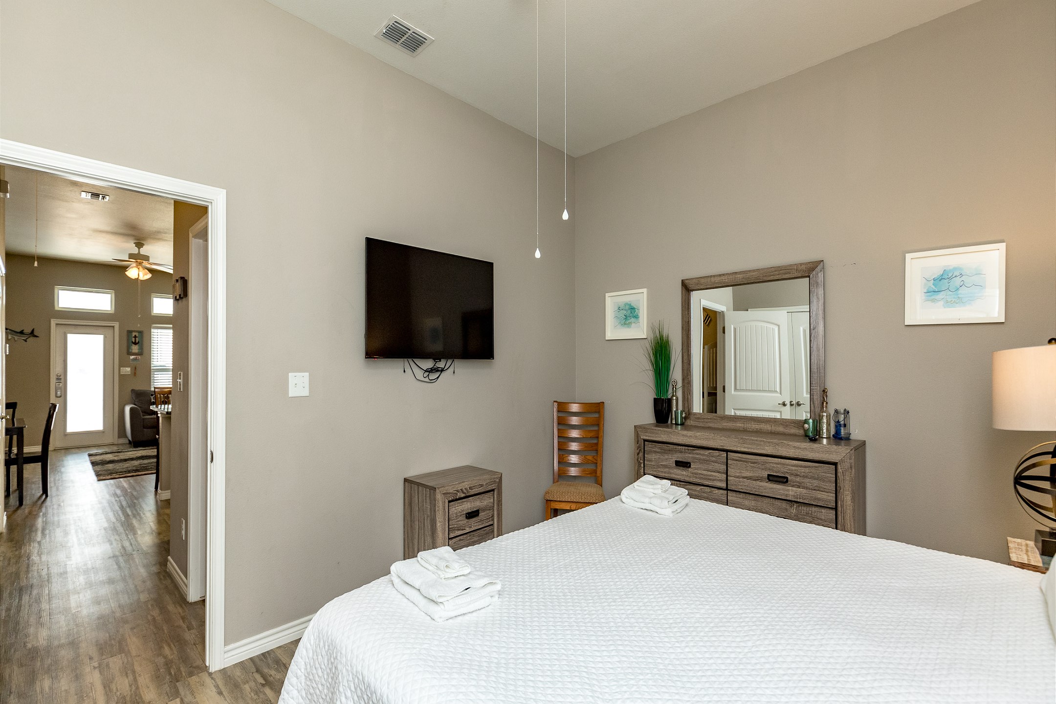 Master bedroom with king size bed and flat screen TV