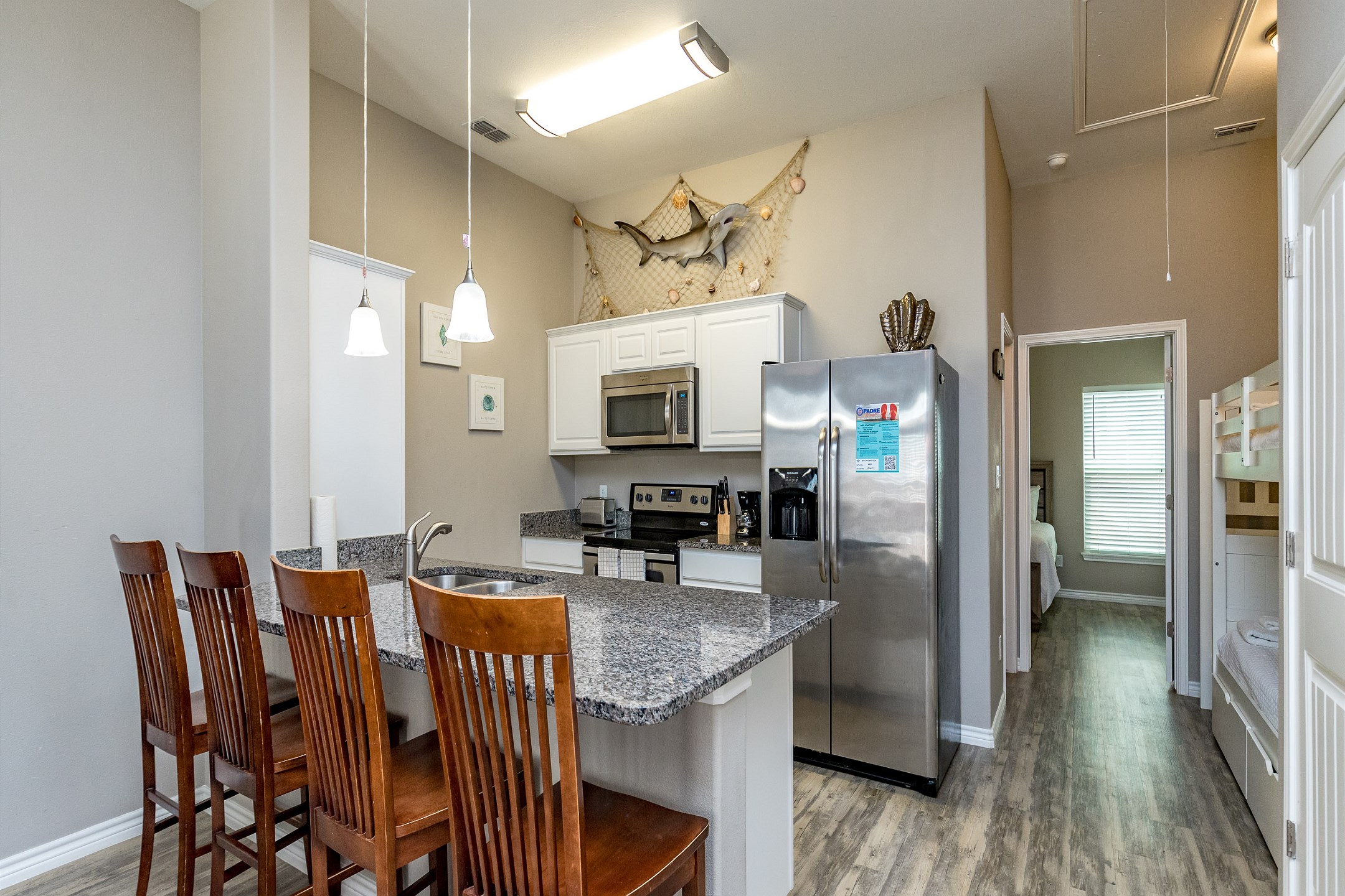 Kitchen area with breakfast bar that offers seating for four