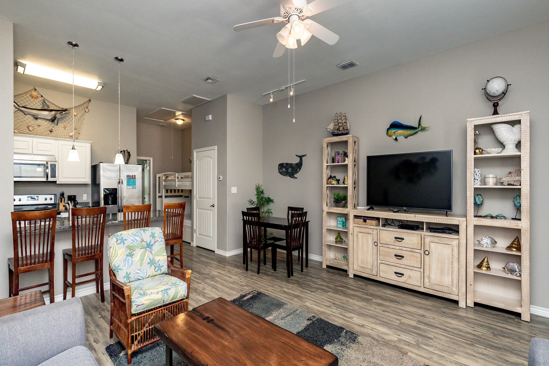 Modern entertainment haven boasting a state-of-the-art flat-screen TV, streaming services, and comfortable lounging options for movie nights