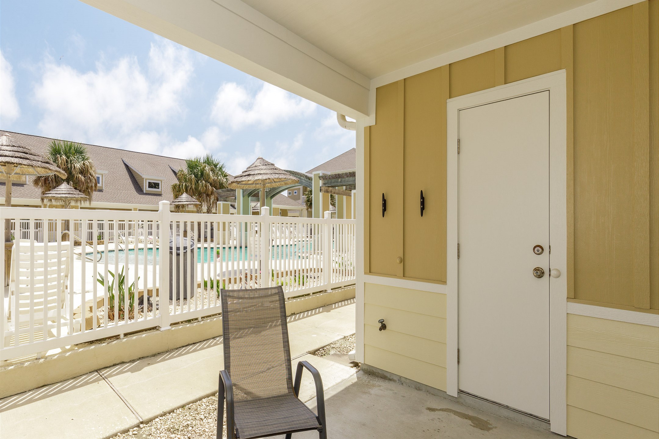 Private patio with pool views, perfect for relaxing