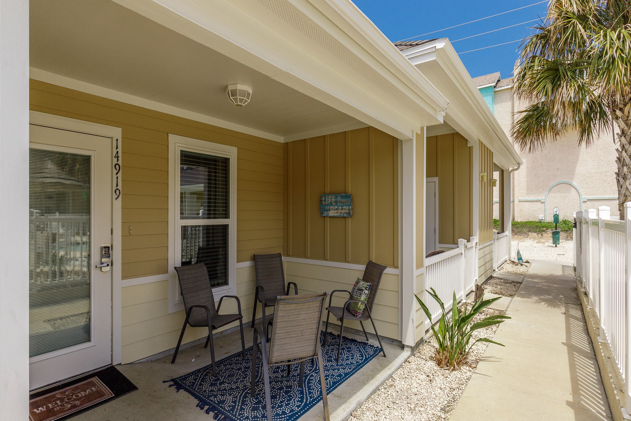 Two reserved parking spaces just behind the townhome, with a short stroll to the front door by the pool