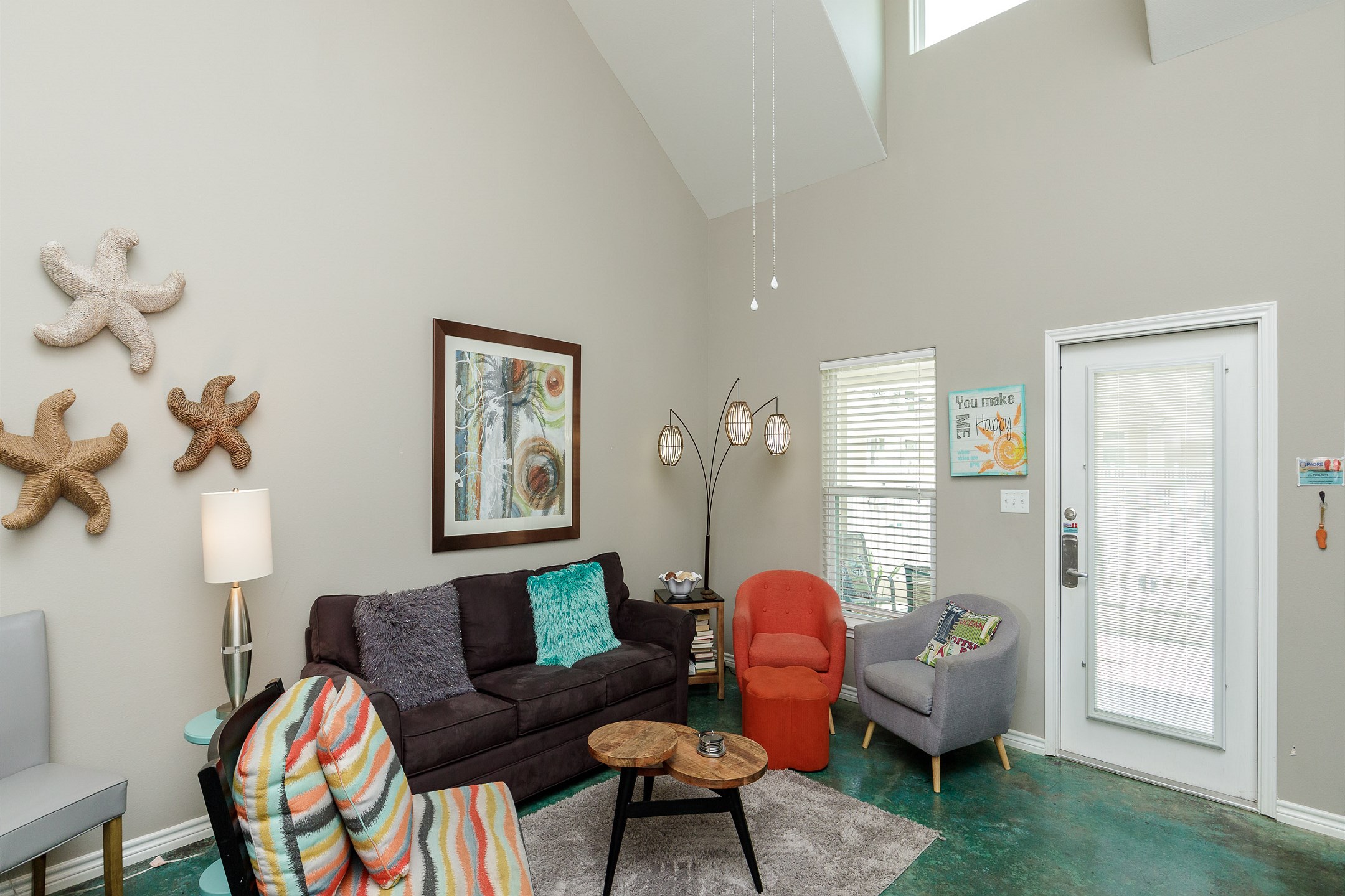 Living area with a queen-size sleeper sofa and playful decor