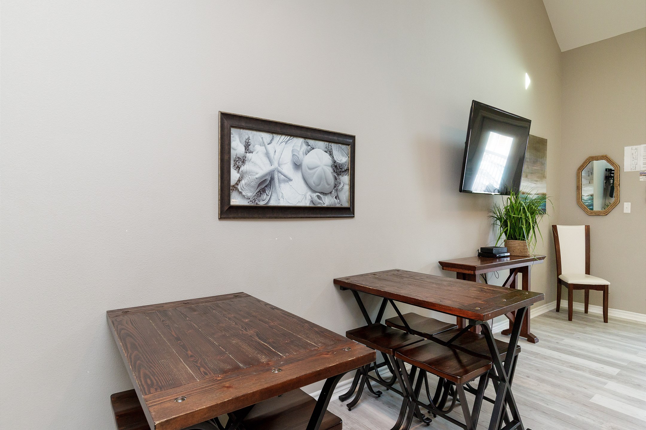 Two dining tables with seating for eight 