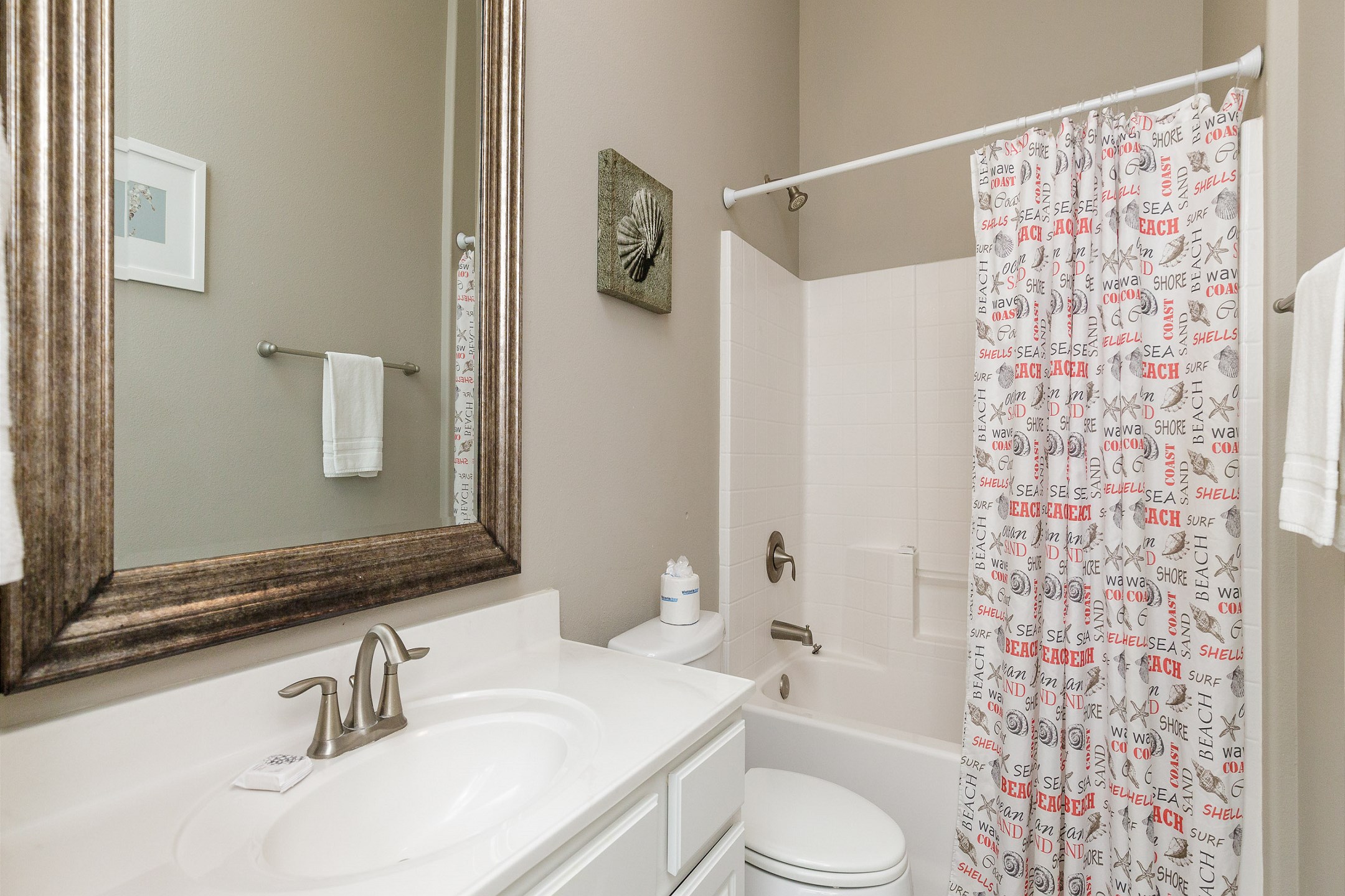Guest bathroom with tub and shower