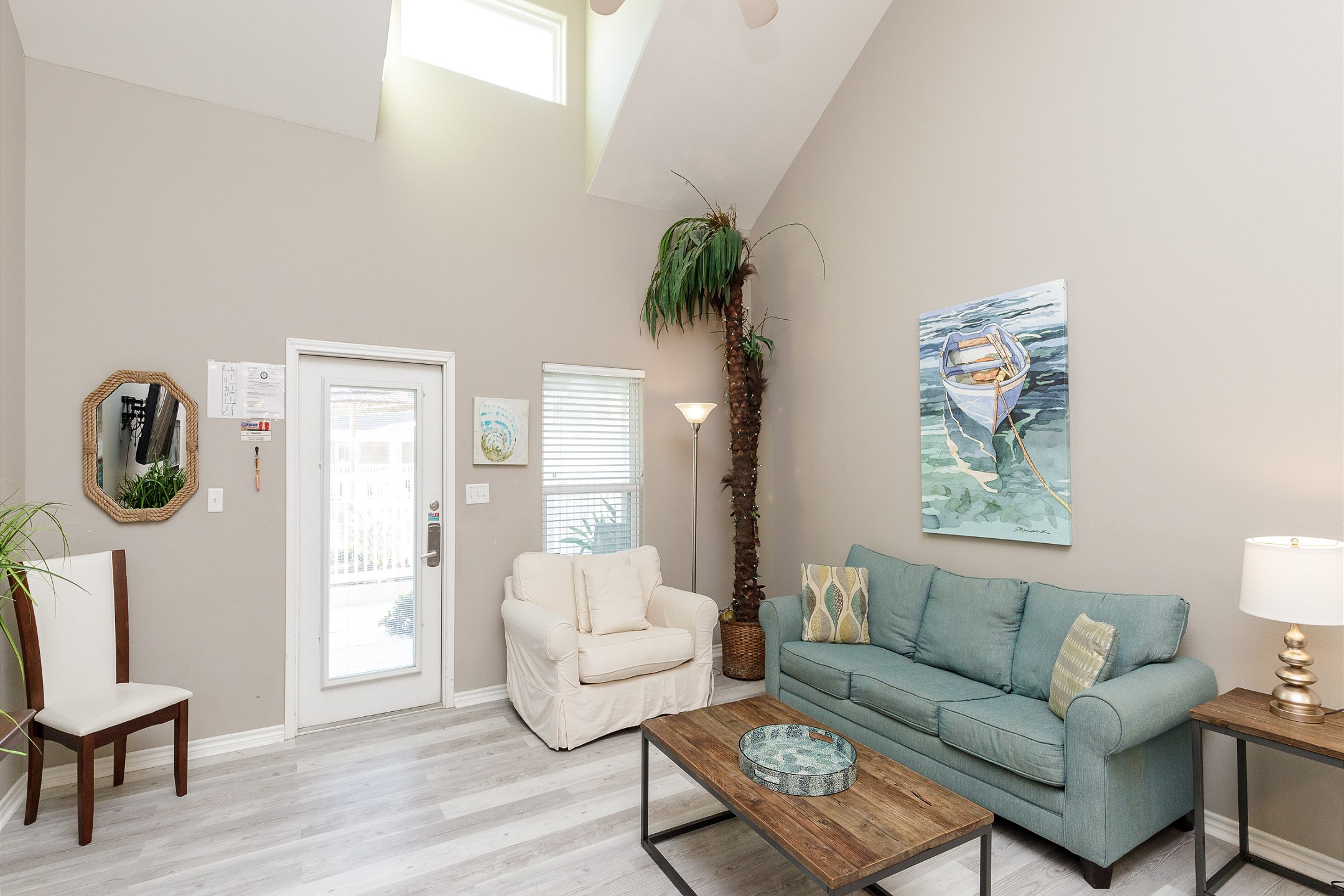 Open-concept living area with high ceilings, flooded with natural light and providing the perfect ambiance for unwinding after a day of adventures