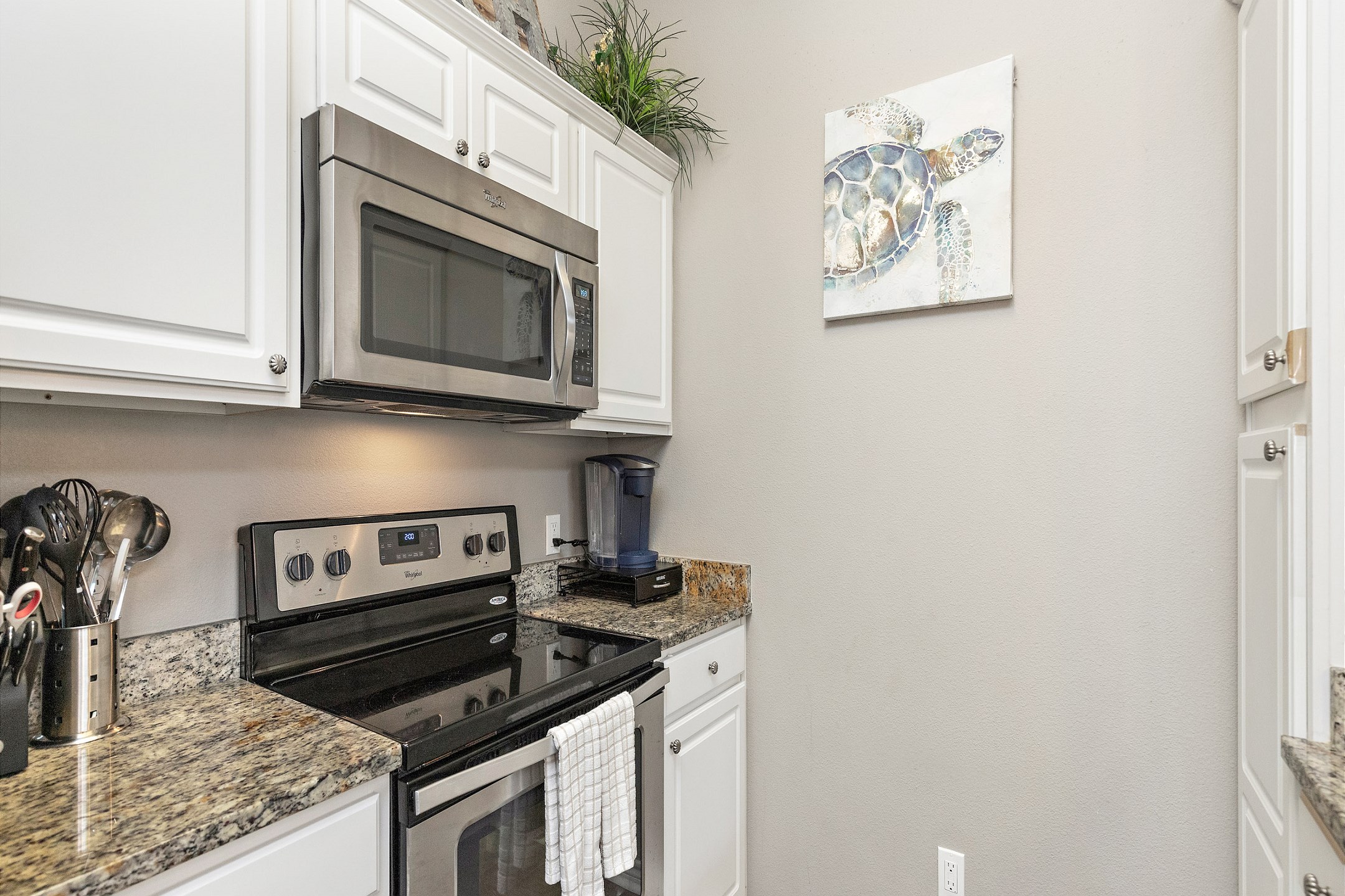 Fully equipped kitchen with stainless steel appliances, Keurig and 12-cup coffee maker 
