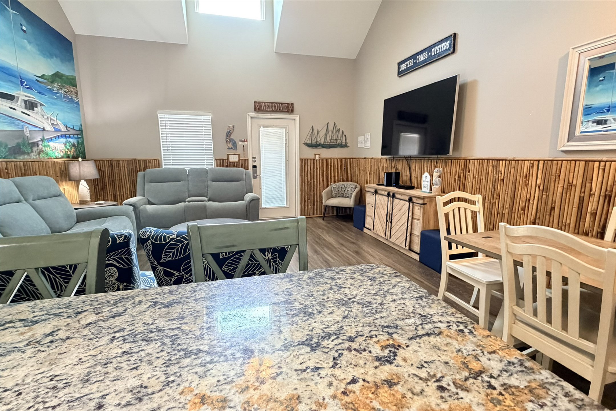 Great open concept space with high ceilings, natural light shinning in and streaming services to enjoy