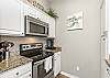 Fully equipped kitchen with stainless steel appliances, Keurig and 12-cup coffee maker 
