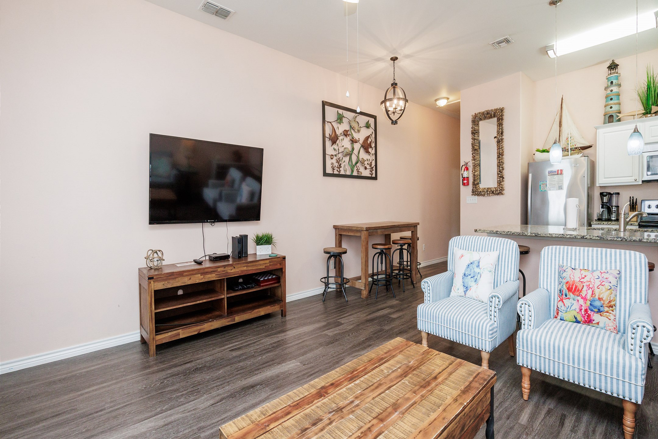 Charming, spacious layout perfect for entertaining, with cozy accent chairs inviting you to relax and unwind