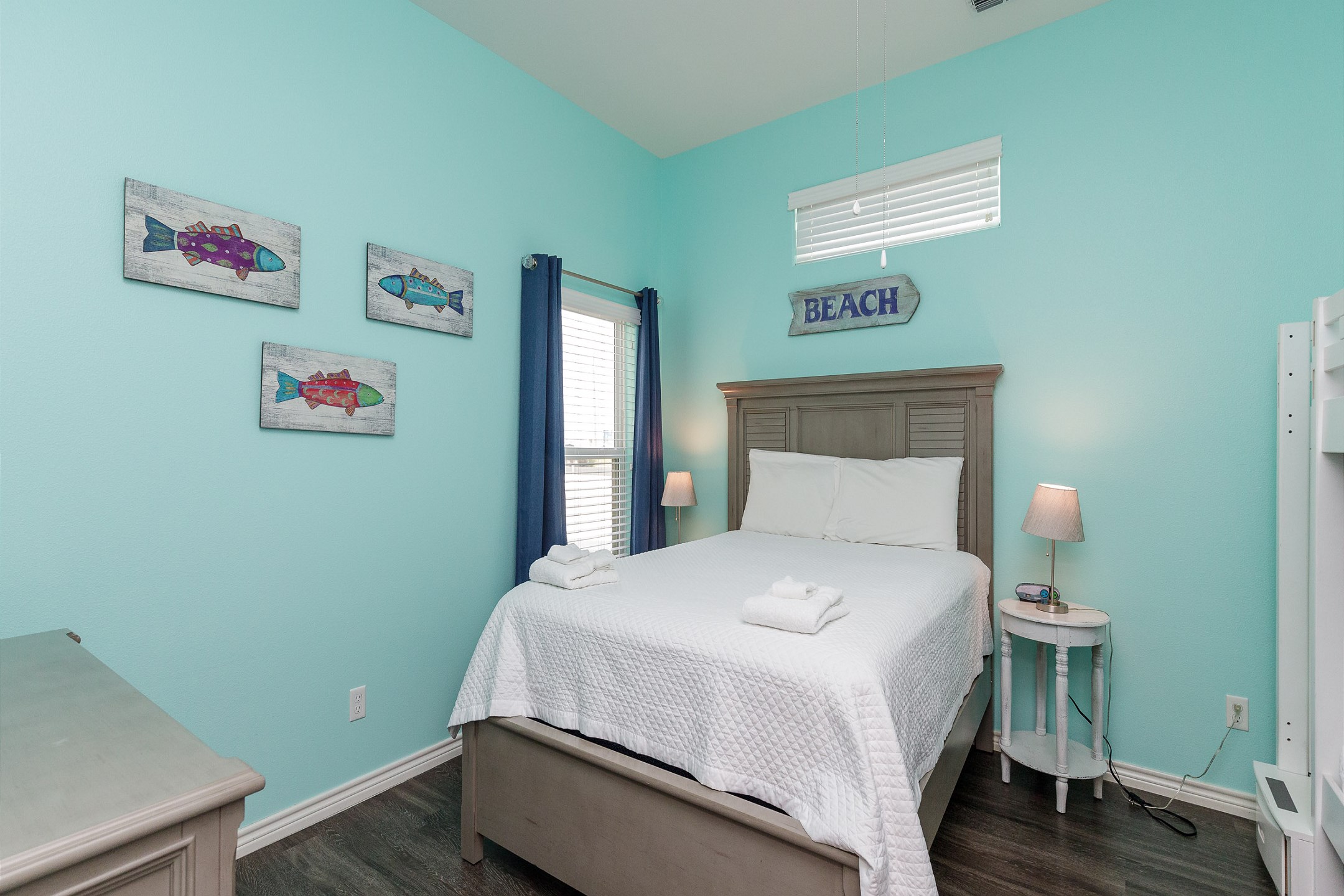 Second bedroom with queen size bed, twin size bunk beds and flat screen TV