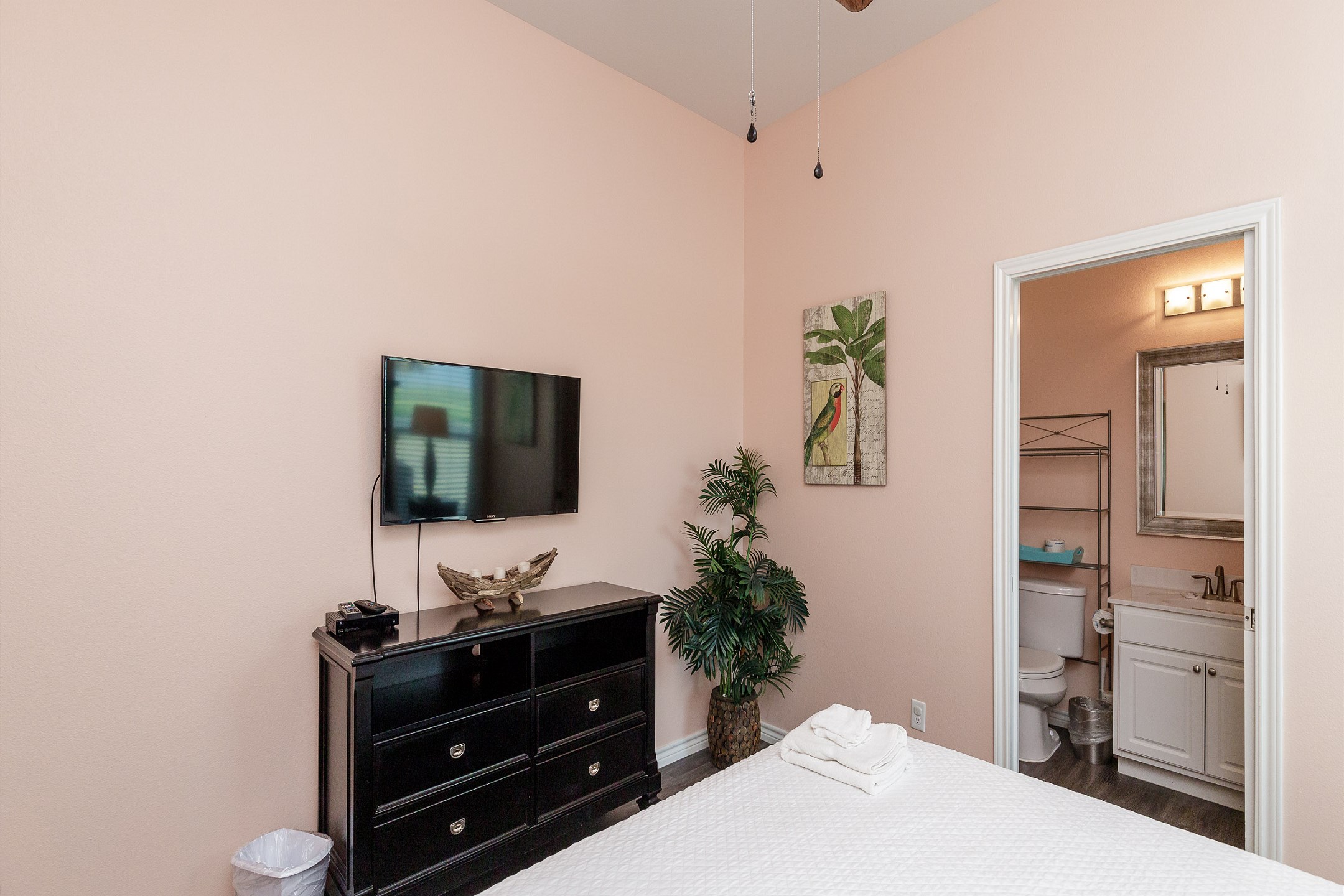 Master bedroom with king size bed, private bathroom and flat screen TV 