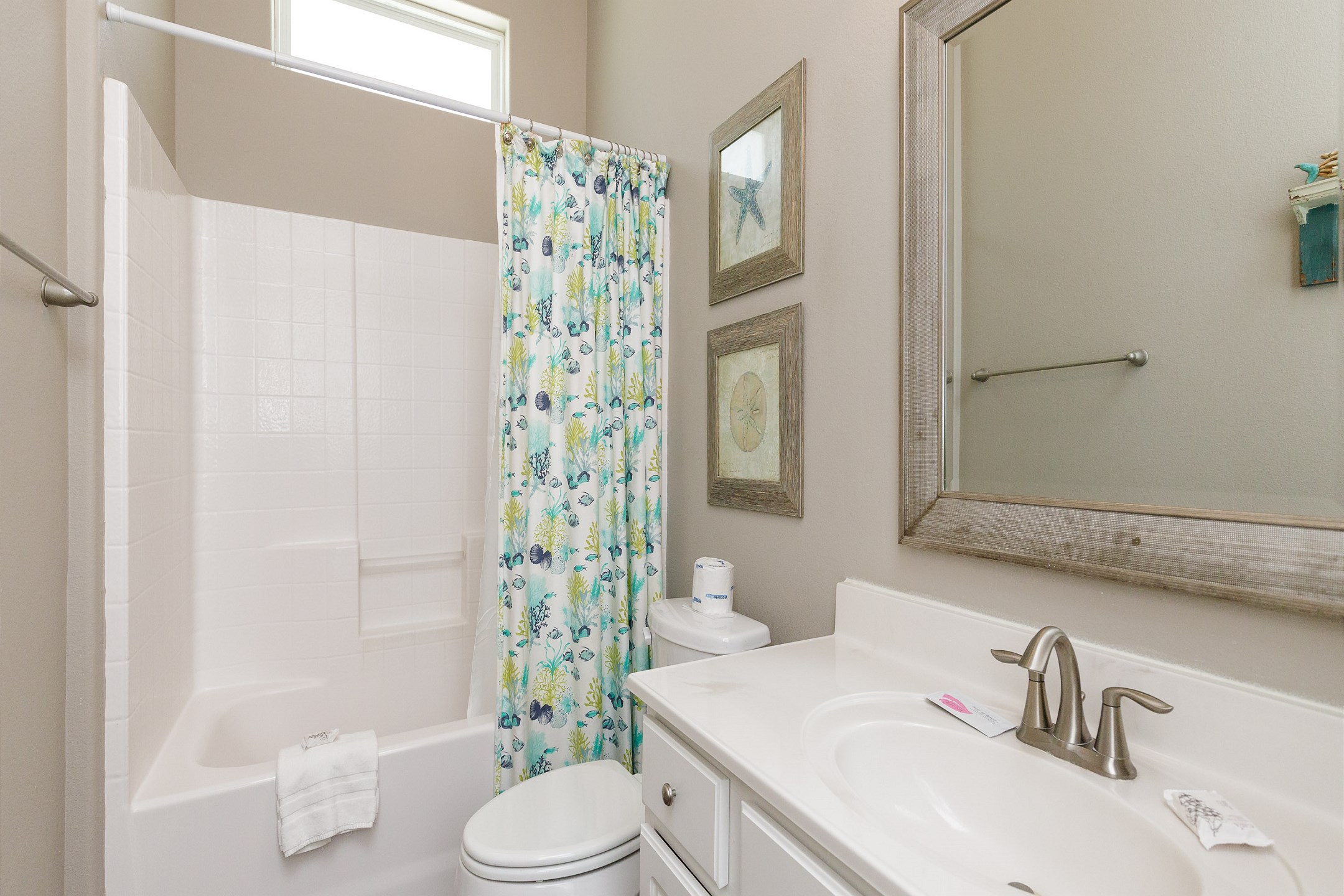 Guest bathroom with tub and shower