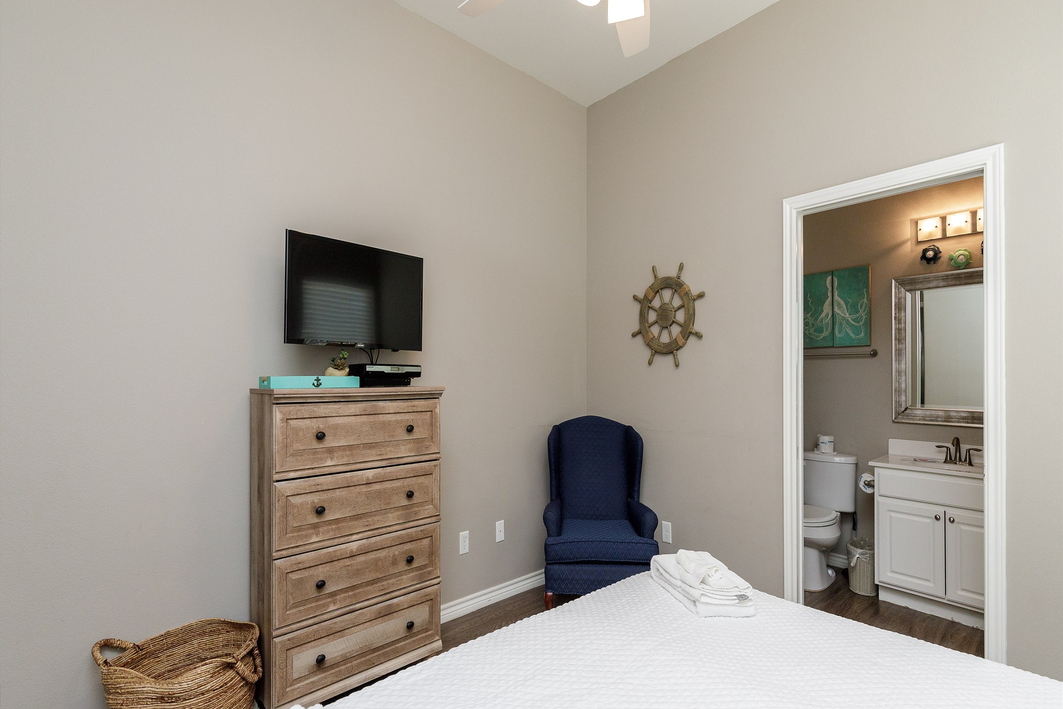 Master bedroom with king size bed, flat screen TV and private bathroom