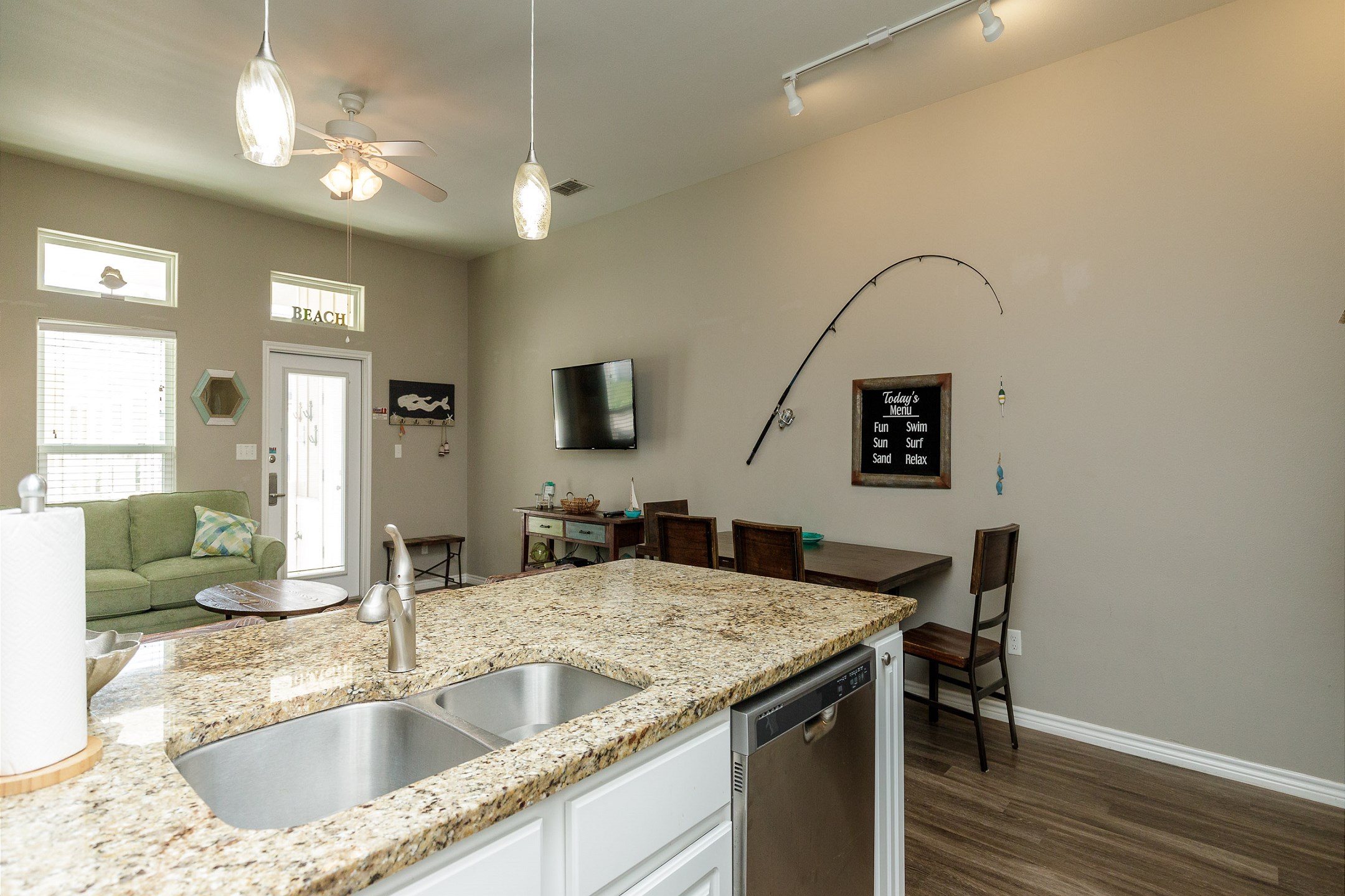 Well-appointed modern kitchen with beautiful granite countertops and generous space for cooking and entertaining