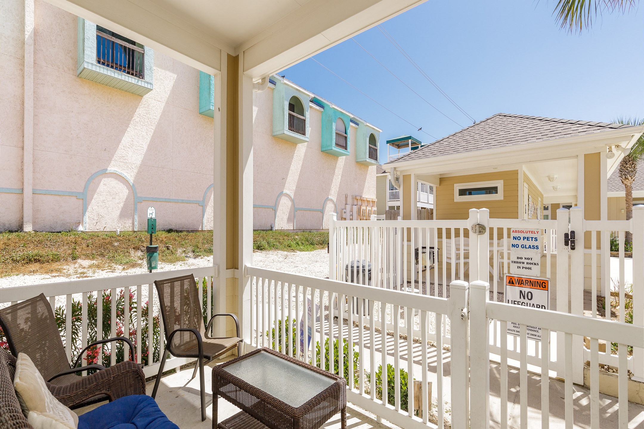 Lovely patio area on the corner right across pool access 