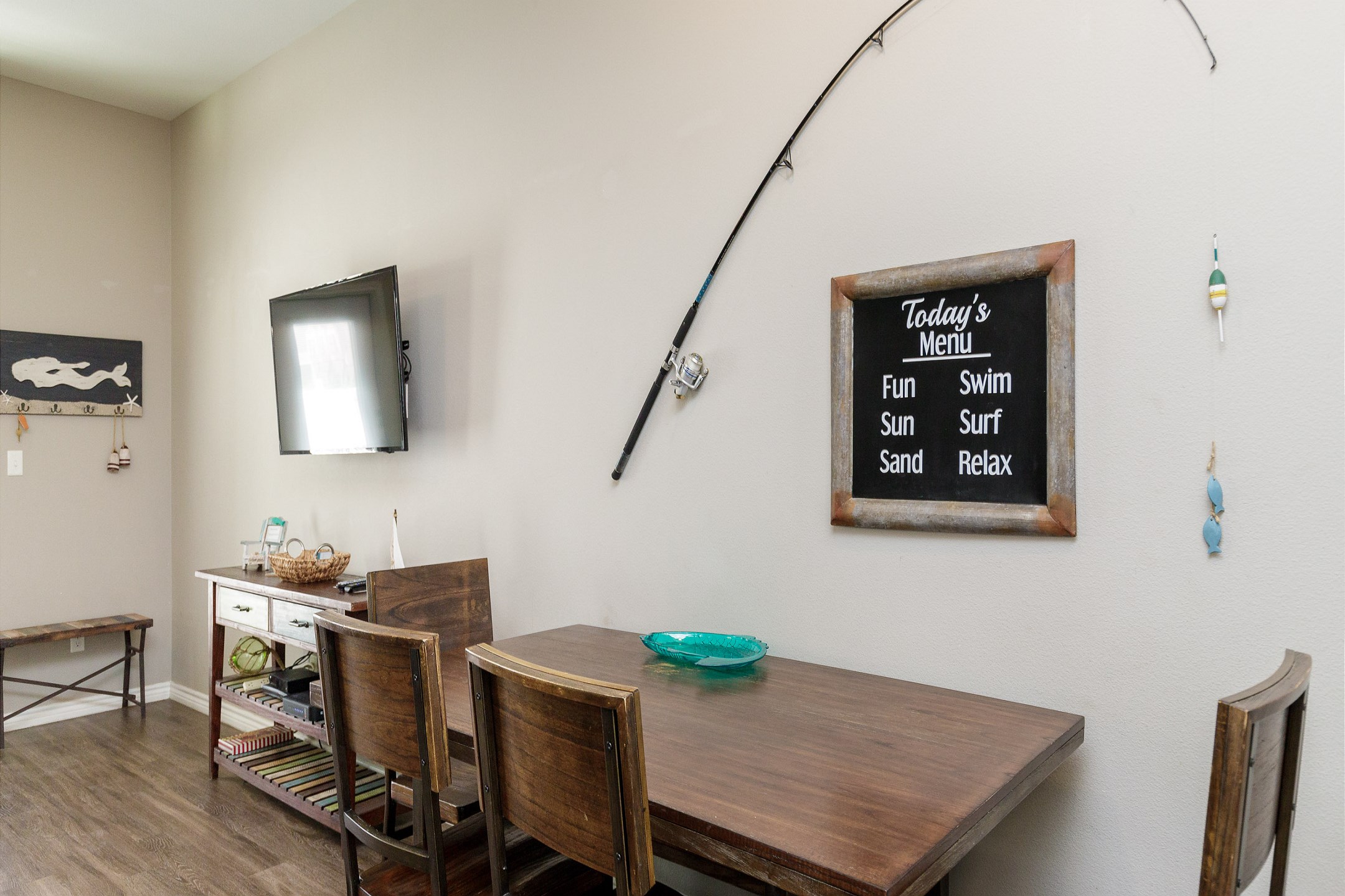 Fishing-themed dining area that seats four for a coastal vibe