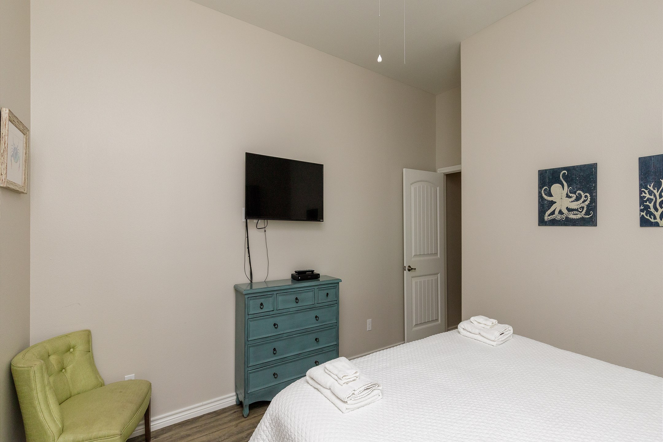 Master bedroom with king size bed, private bathroom and flat screen TV