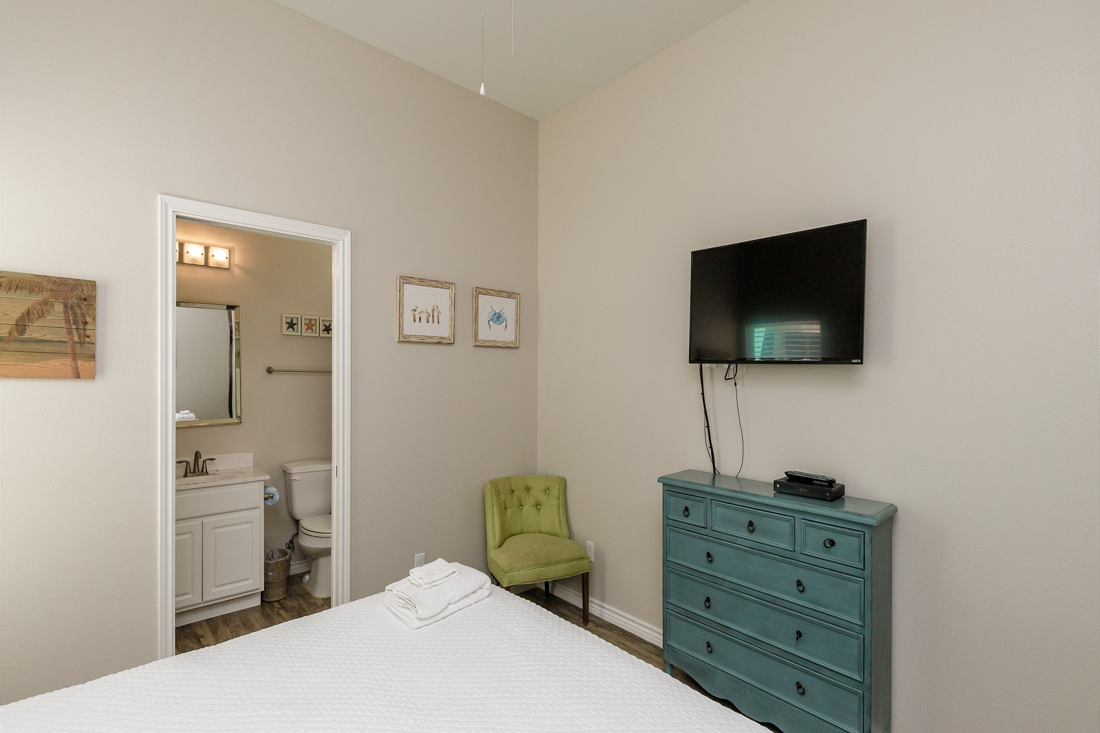 Master bedroom with king size bed, private bathroom and flat screen TV