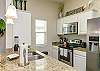 Fully equipped kitchen area with stainless steel appliances 