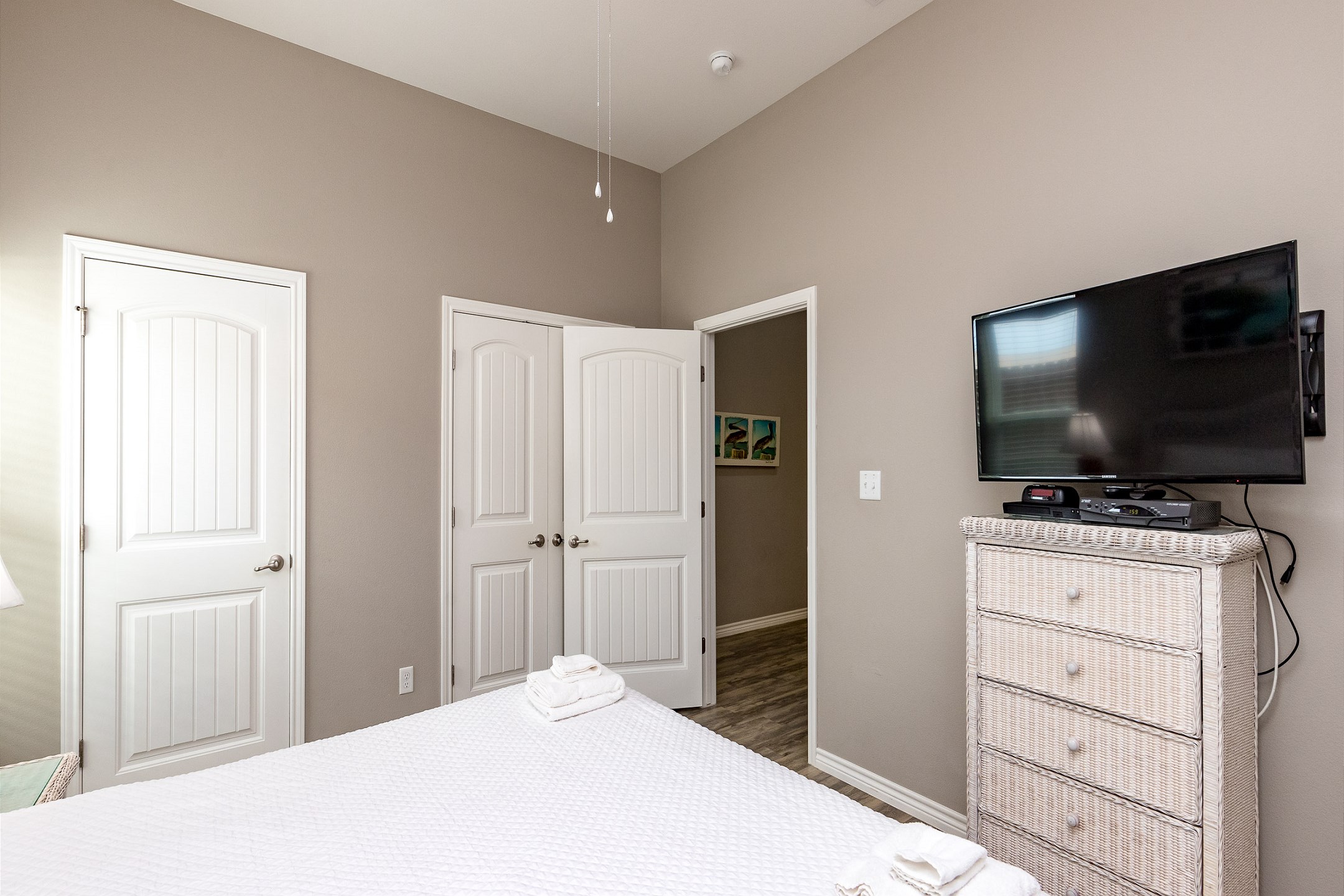 Master bedroom with king size bed and flat screen TV