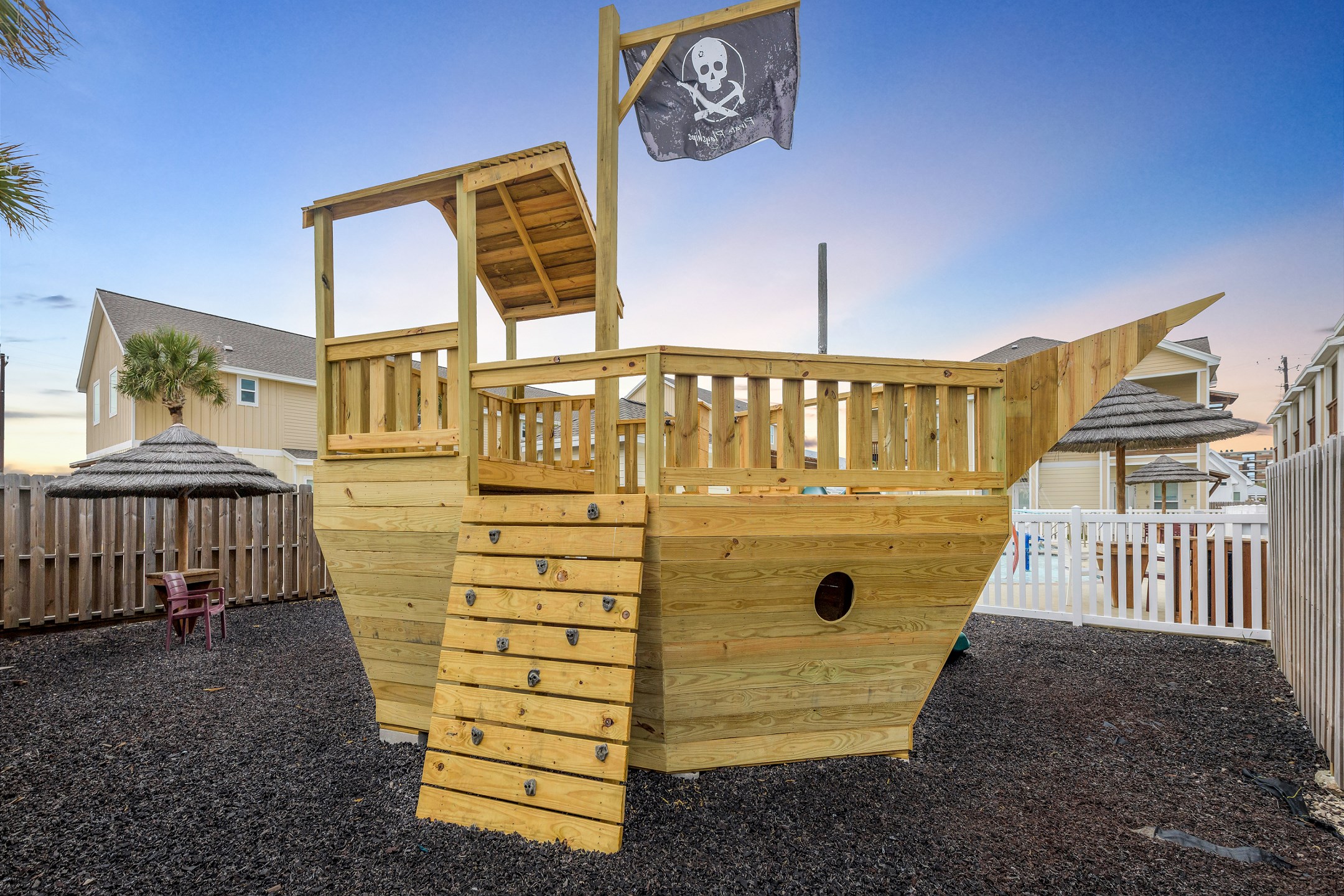 Pirate ship playground with swings and slides