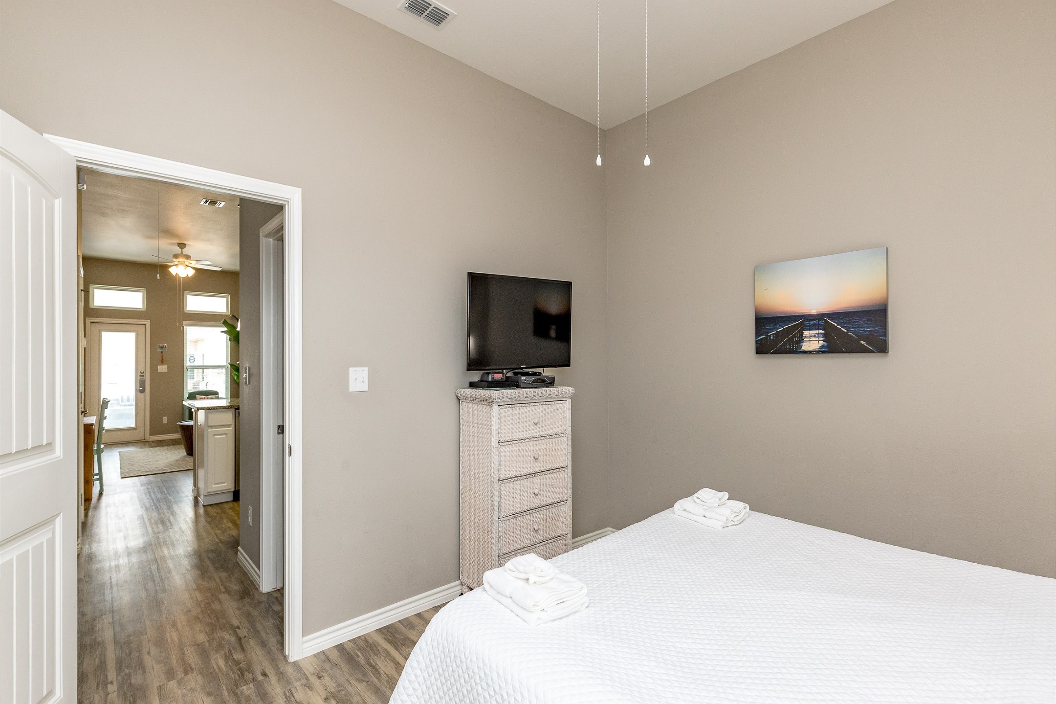 Master bedroom with king size bed and flat screen TV