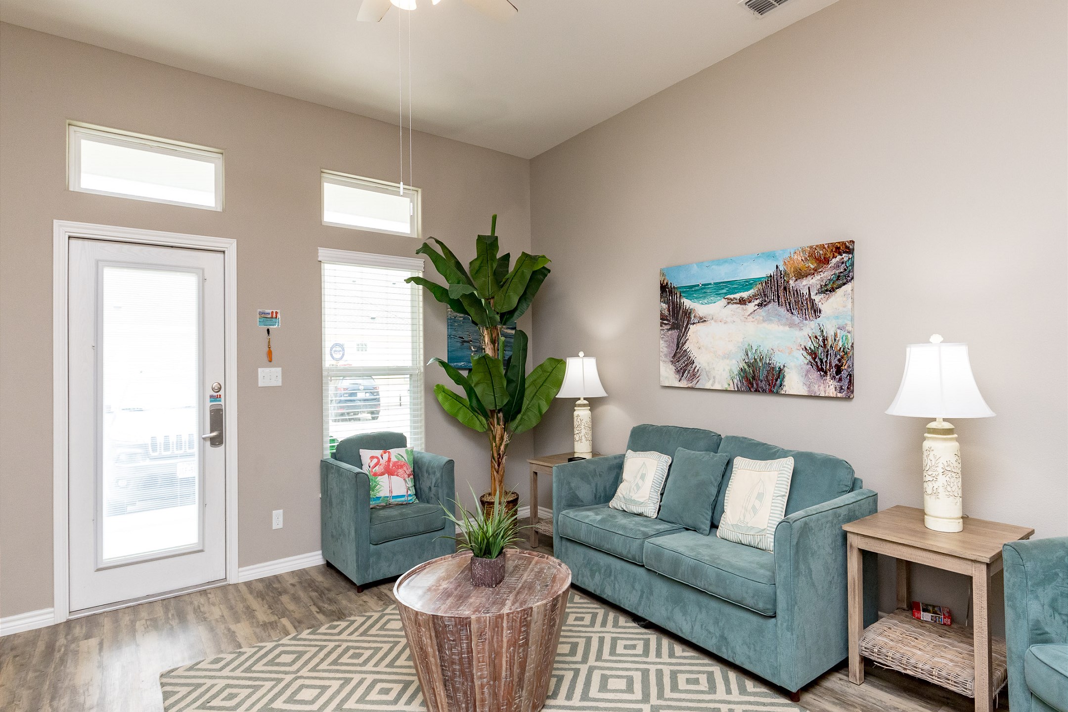 Living area with cozy seating and coastal decor