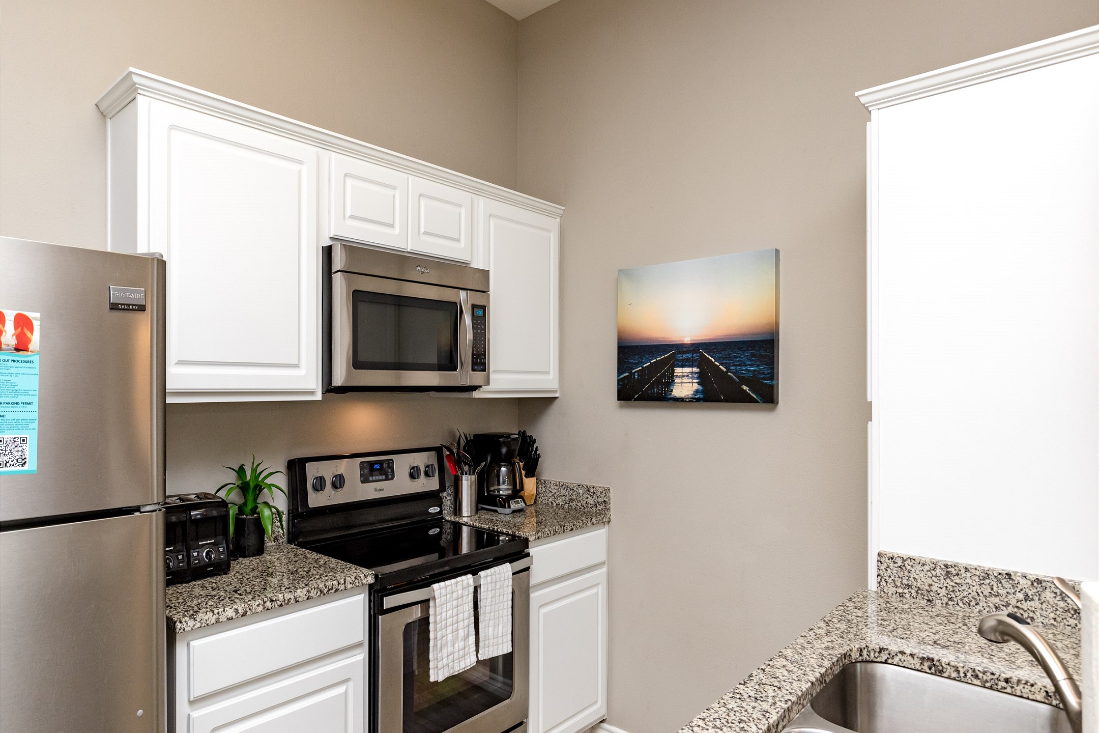 12-cup coffee maker, toaster, and other essentials provided in the kitchen space