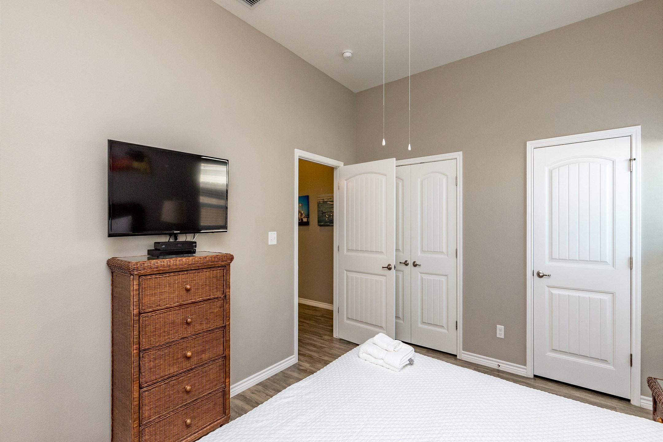 Master bedroom with king size bed and flat screen TV