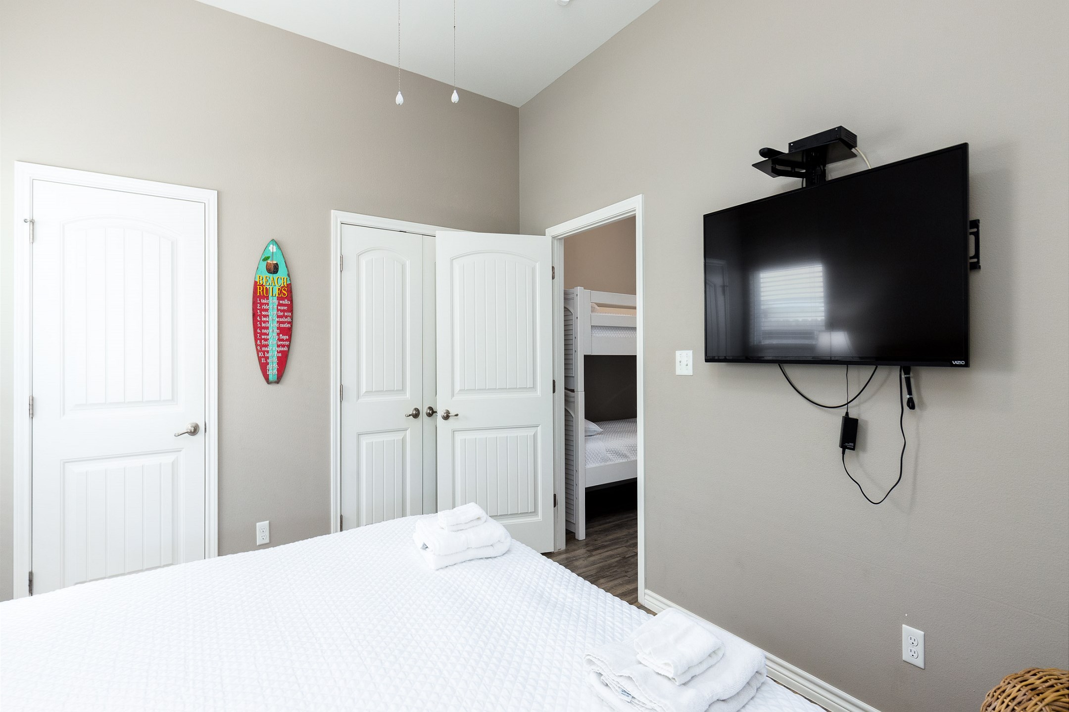 Master bedroom with king size bed and flat screen TV