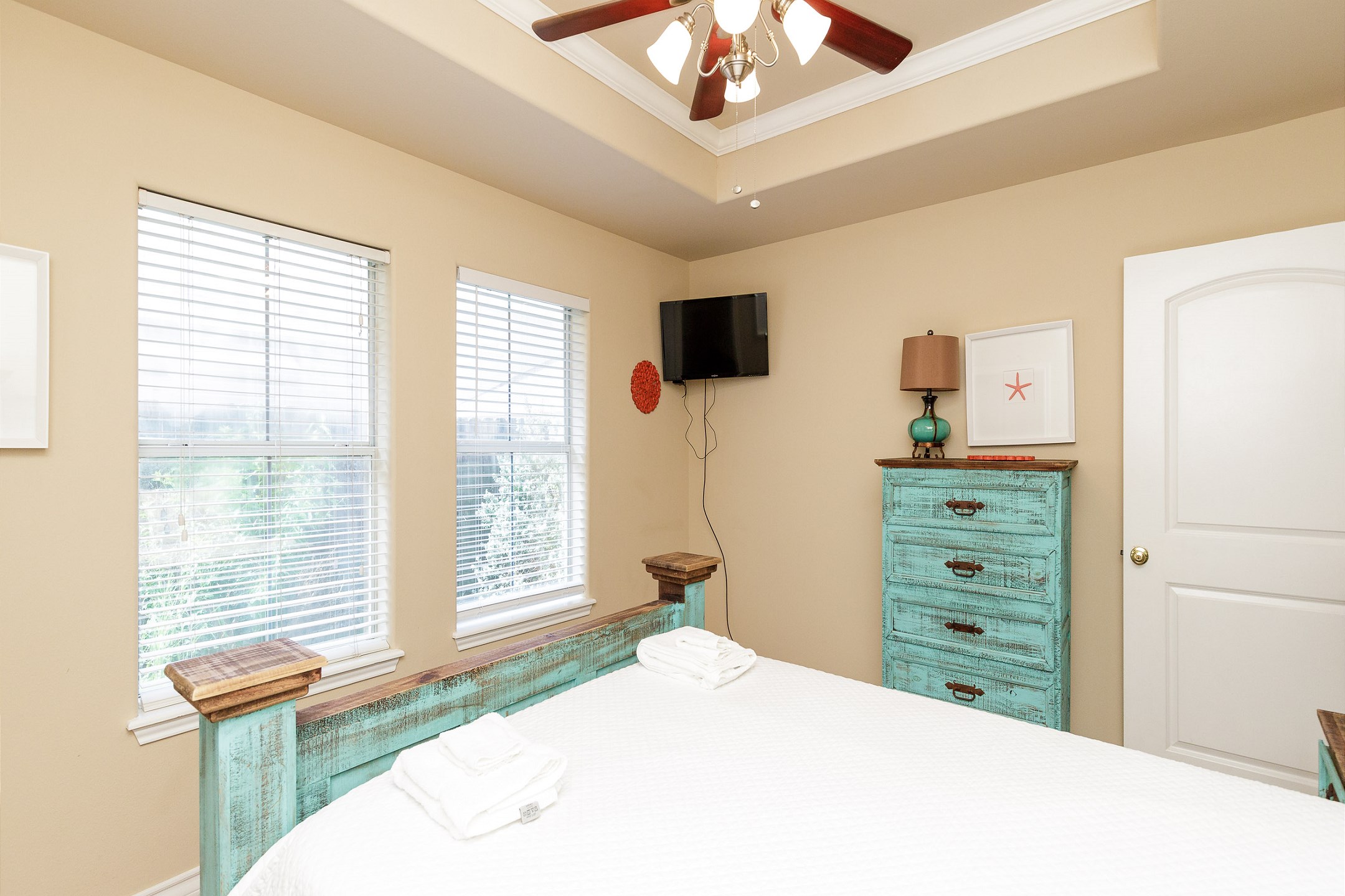Master bedroom on the first floor with queen size bed, private bathroom and flat screen TV
