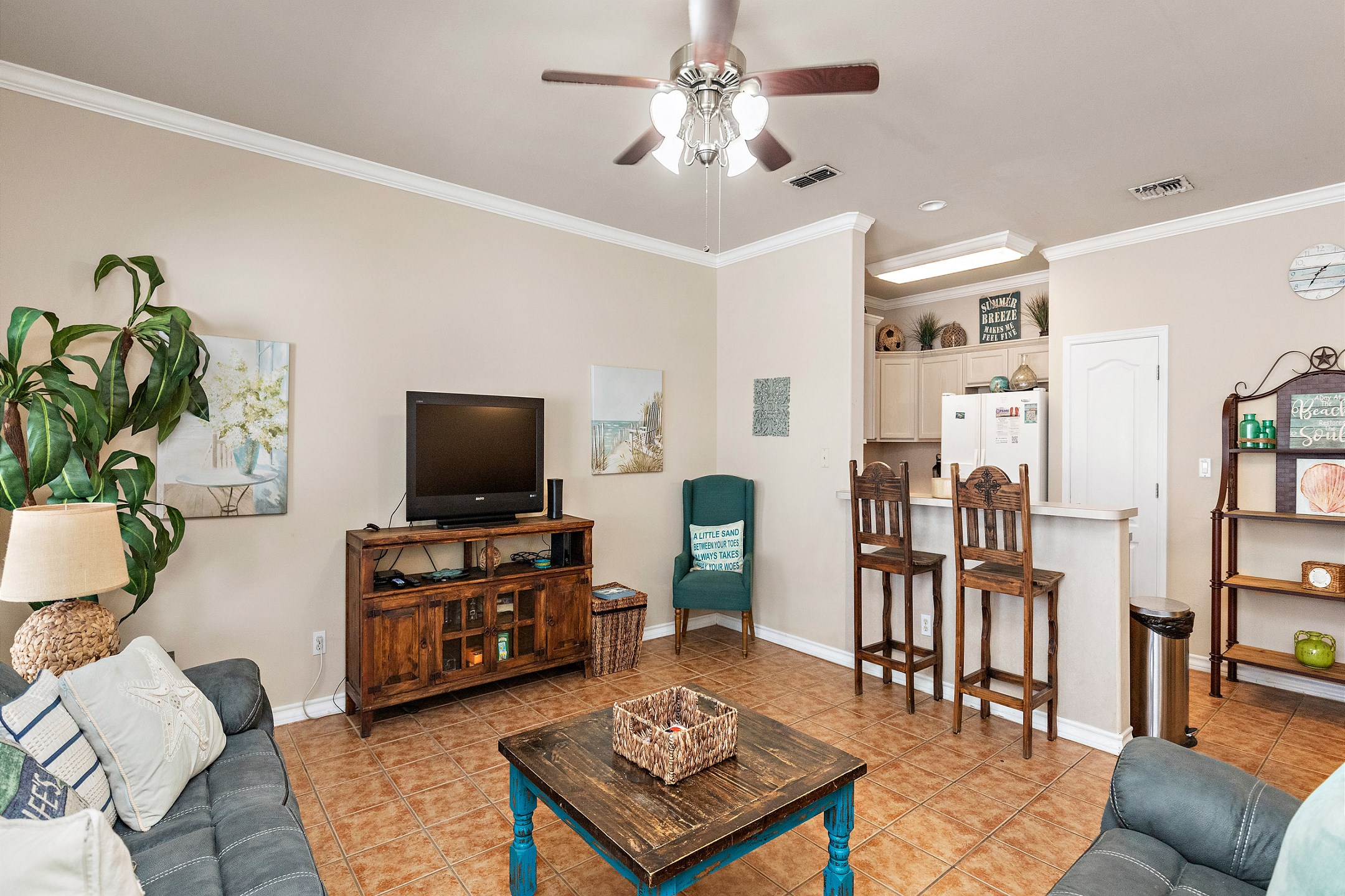 Lots of natural light in this comfy living area with flat screen TV