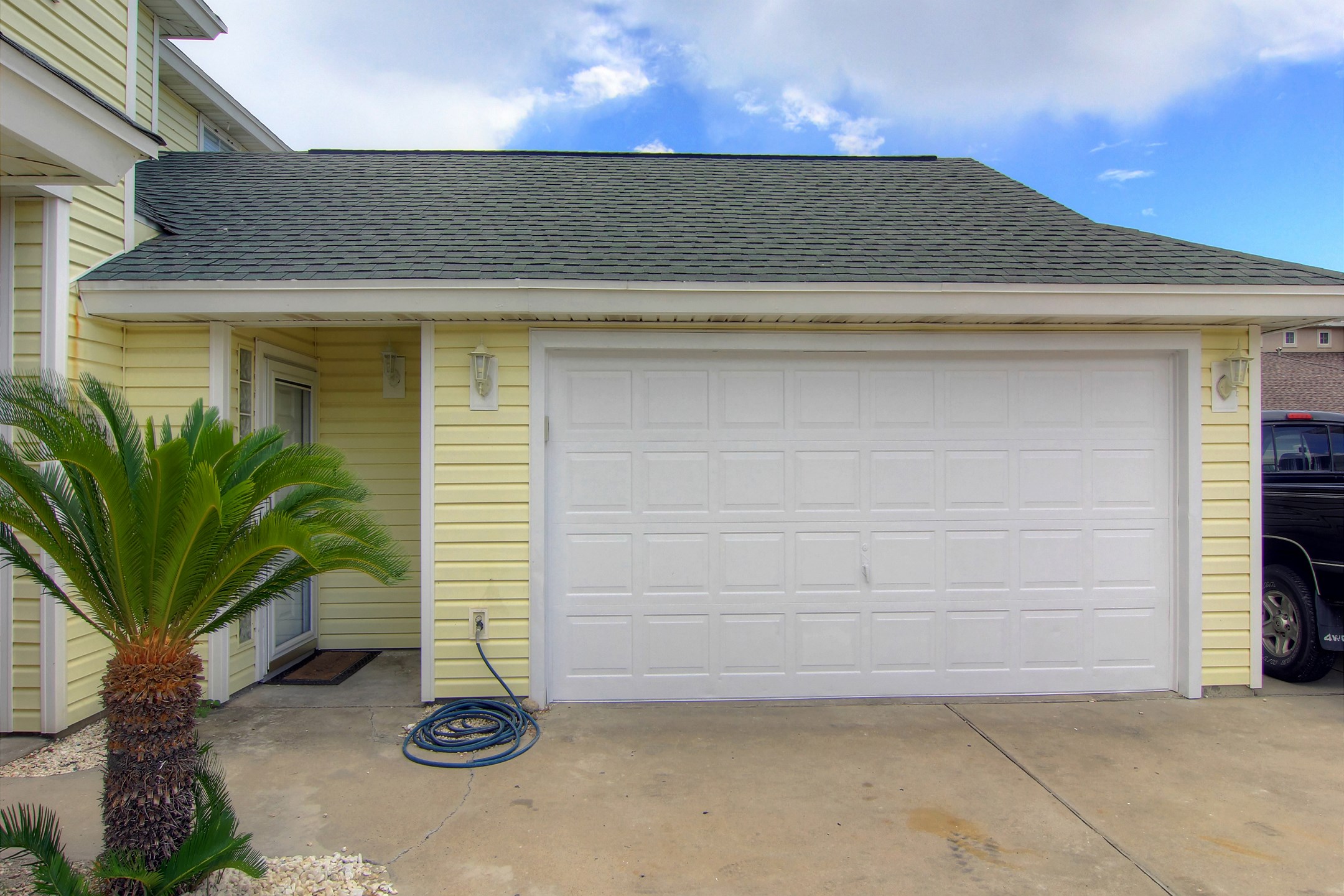 Front view of property with two car garage parking