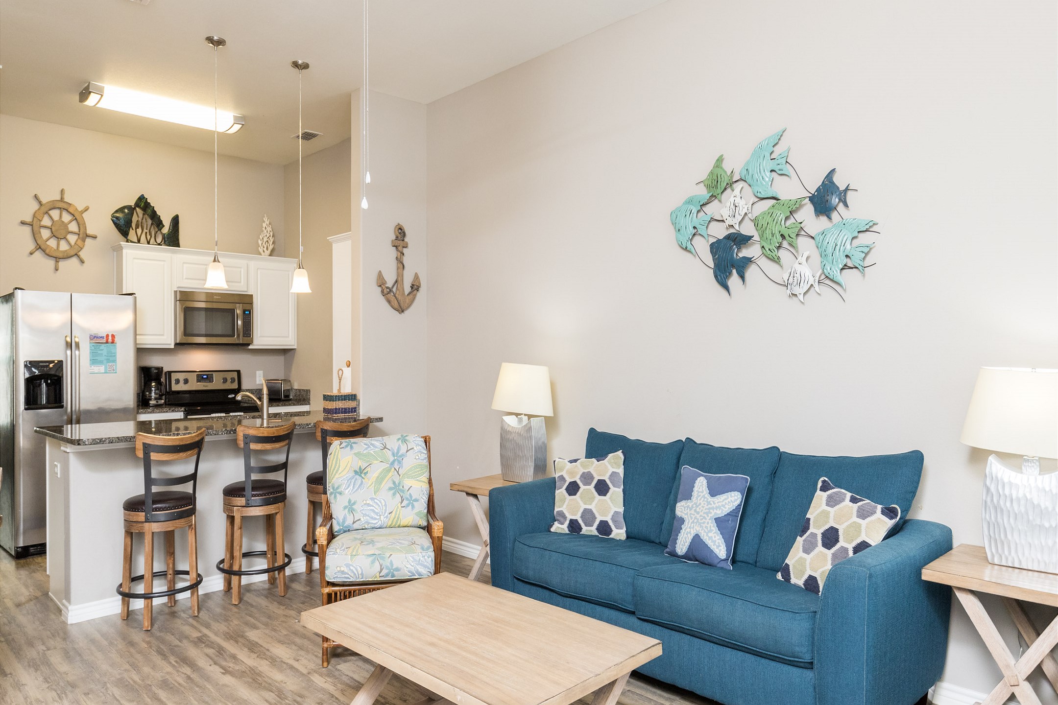 The kitchen, dining, and living areas blend together seamlessly for a bright and airy feel