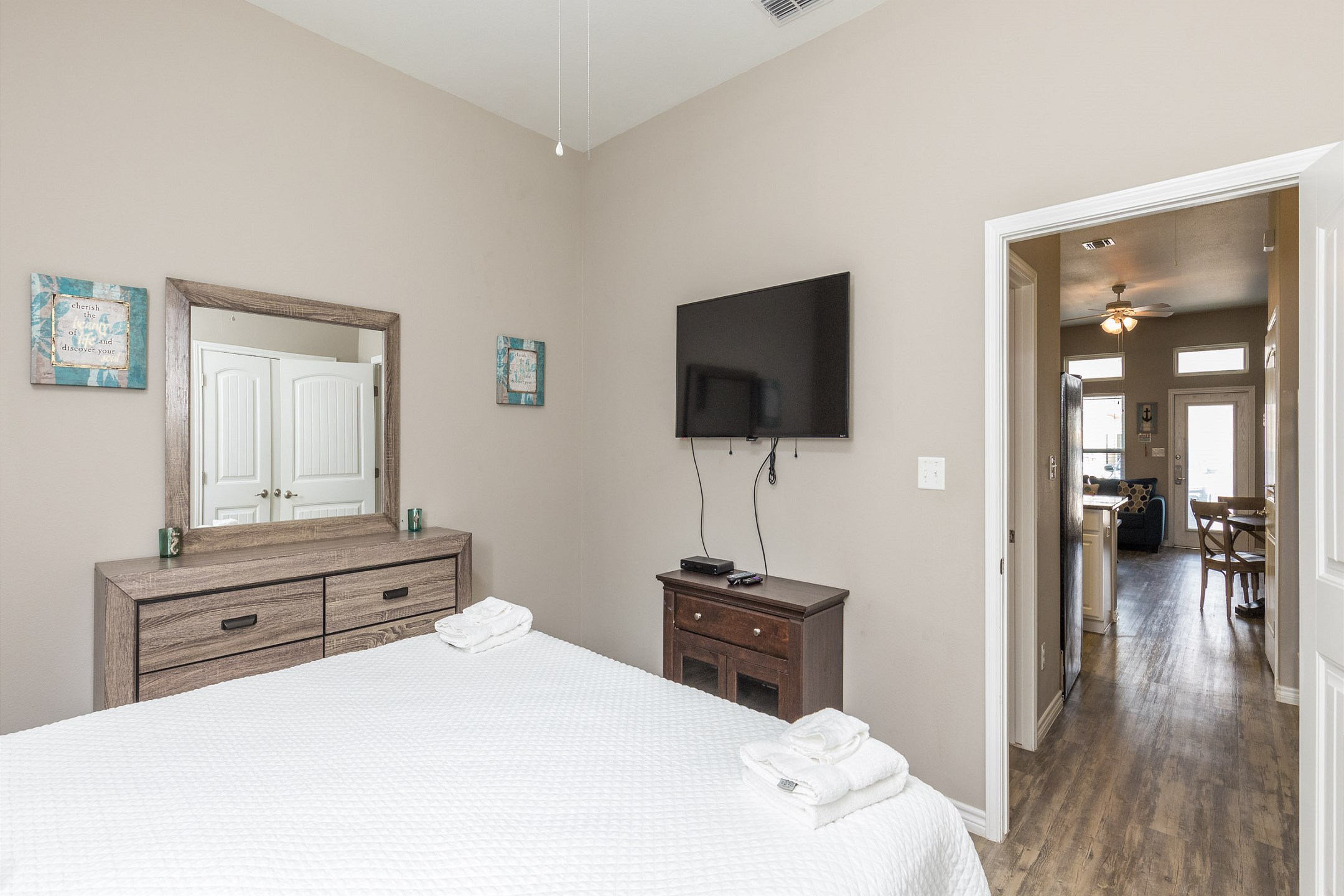 Master bedroom with king size bed and flat screen TV