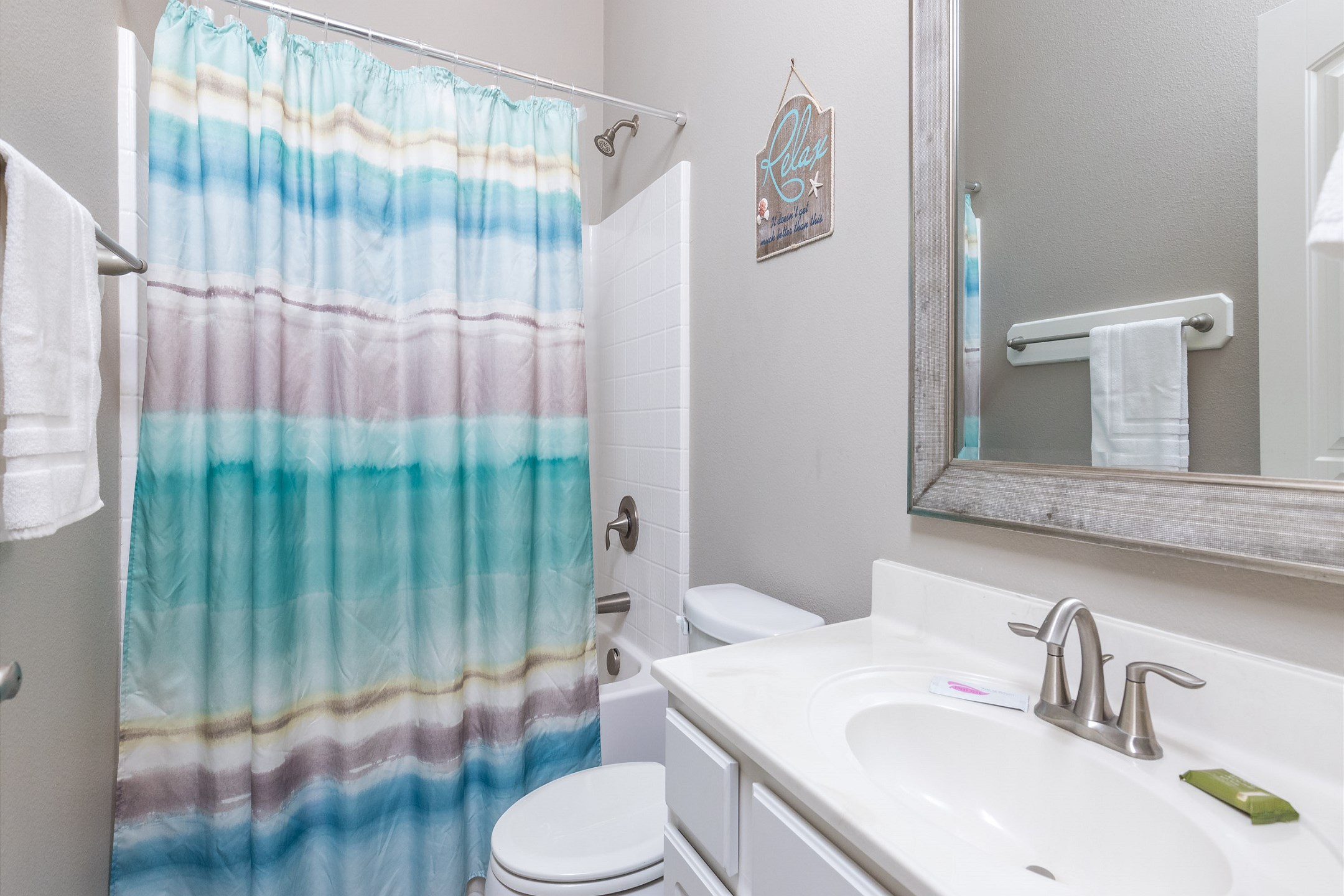 Guest bathroom with tub and shower