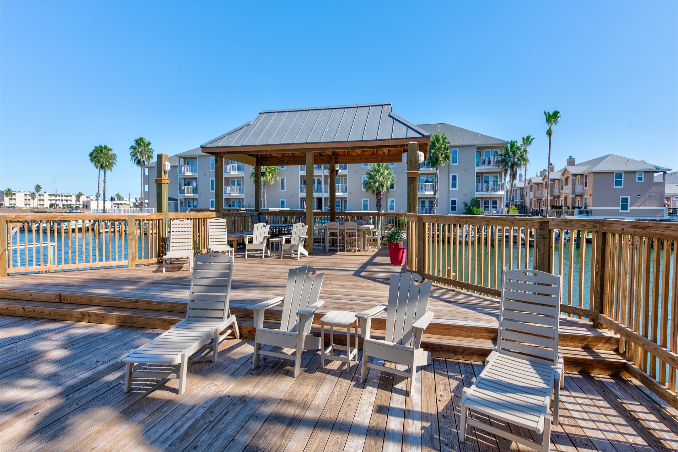 Large deck space with cozy lounge chairs that over look the canal waters