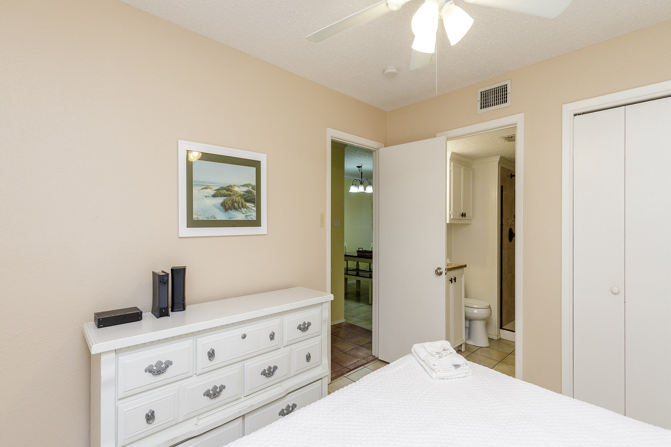 Master bedroom with king size bed and private bathroom